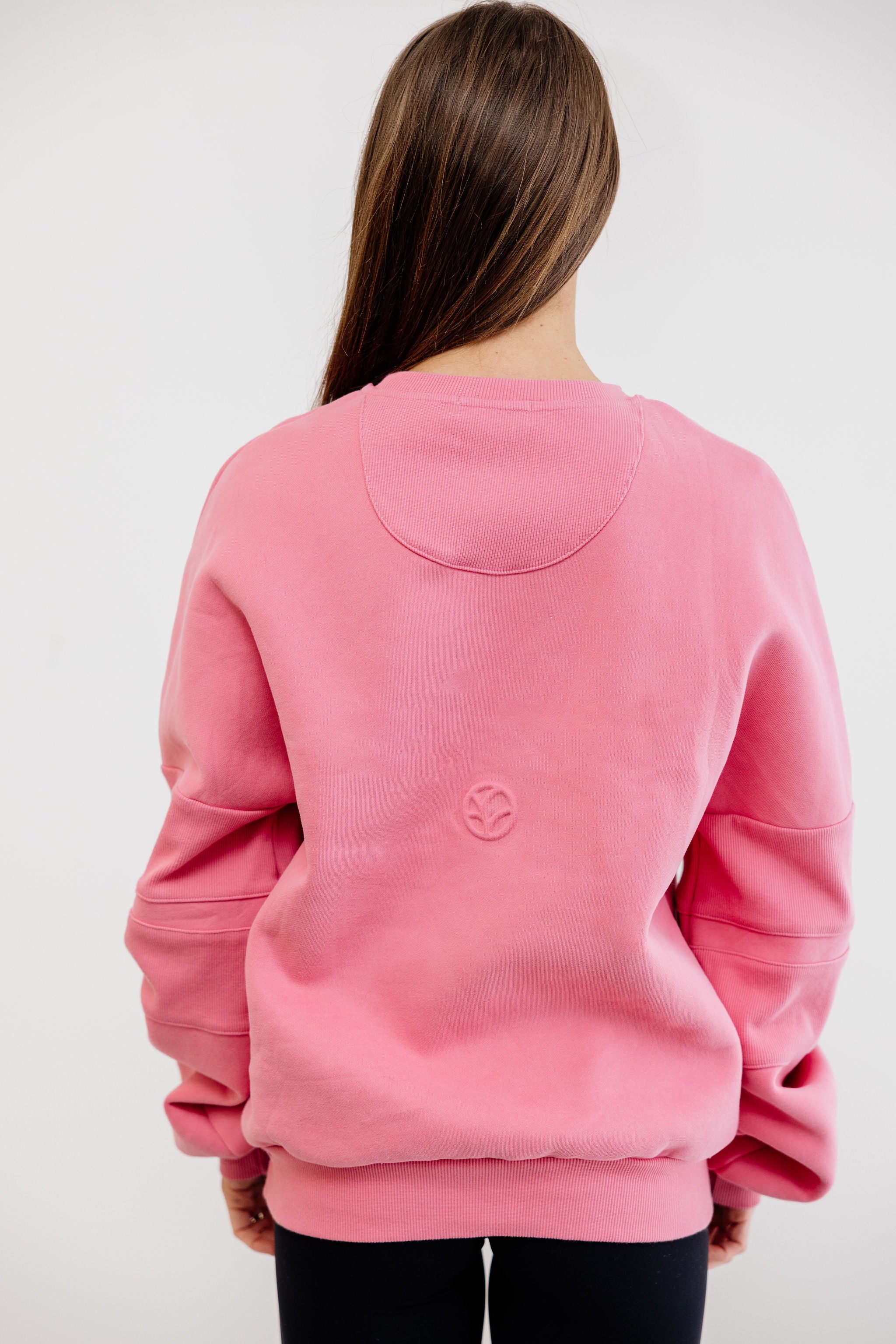 peony pink crew neck jumper with ribbed arm panels in pink with embossed logo breast cancer awareness