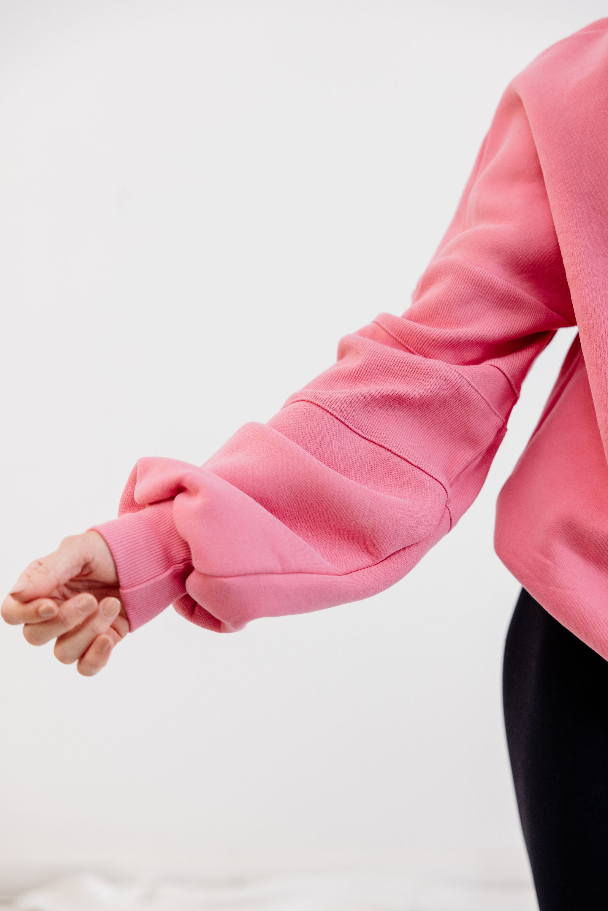 peony pink crew neck jumper with ribbed arm panels in pink with embossed logo breast cancer awareness