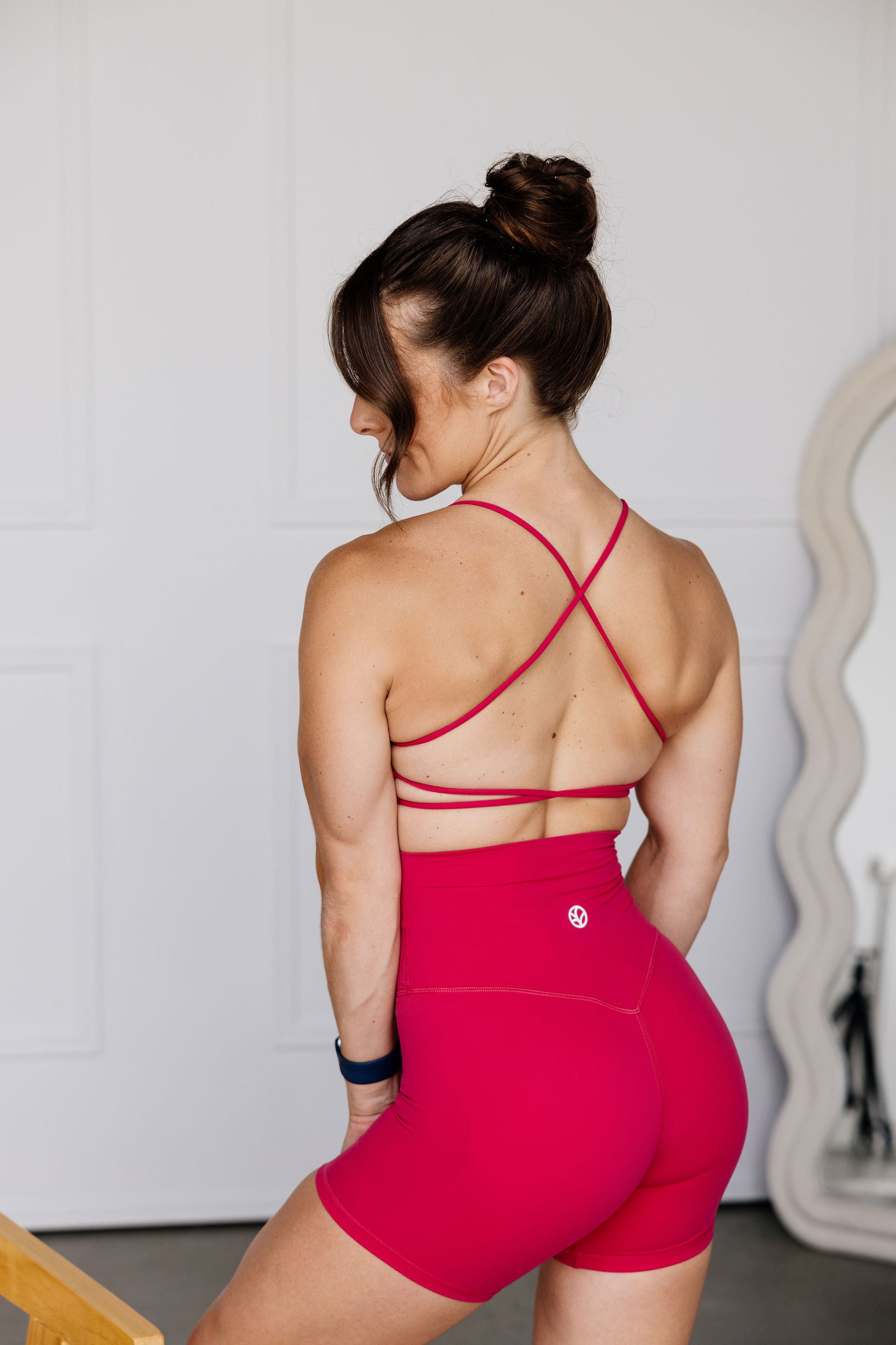 buttery soft sports bra with spaghetti straps and cross back strap design in rose red