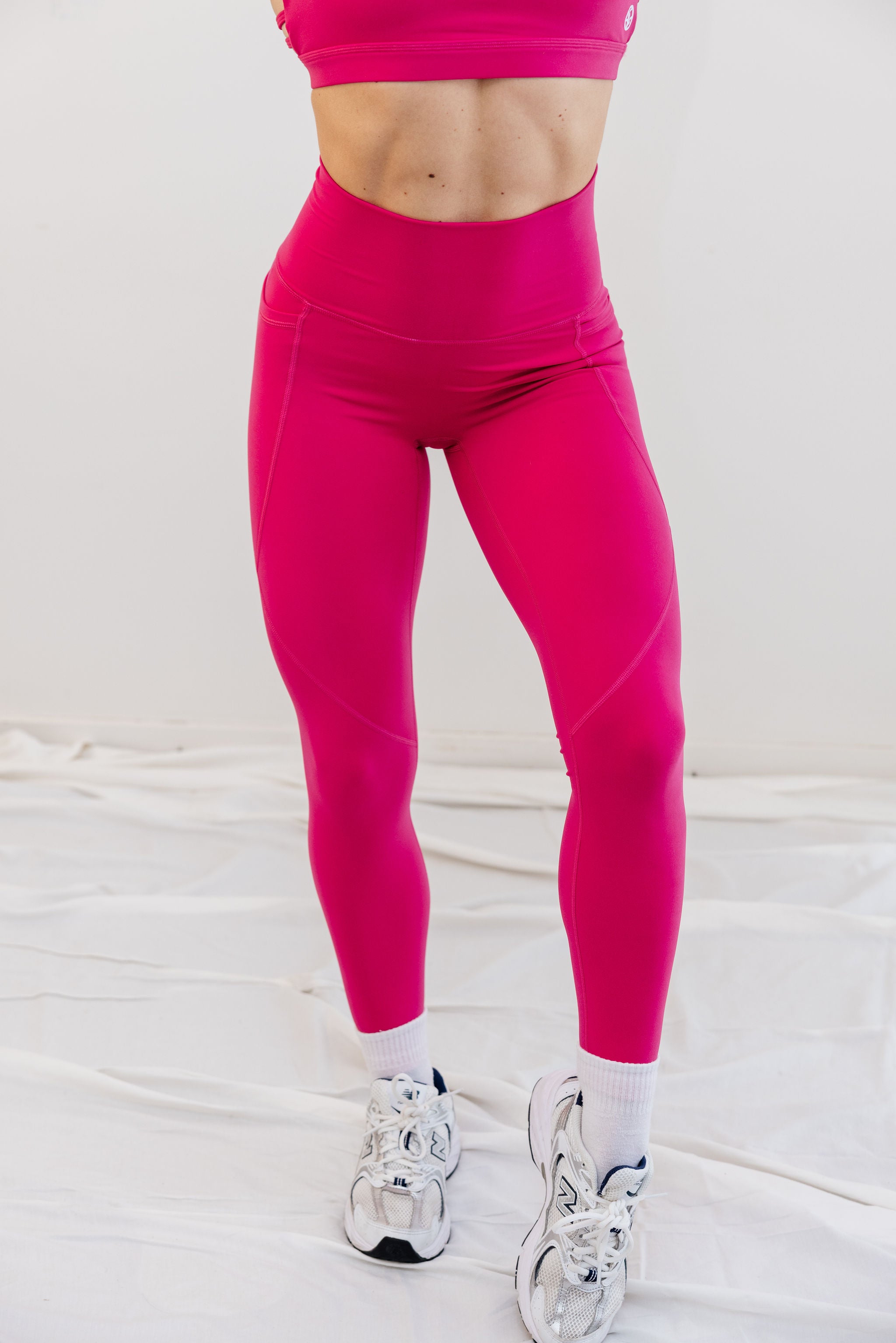 buttery soft tights with pockets, a back zip pocket with seamless front rise in rose red with soft v shape front rise