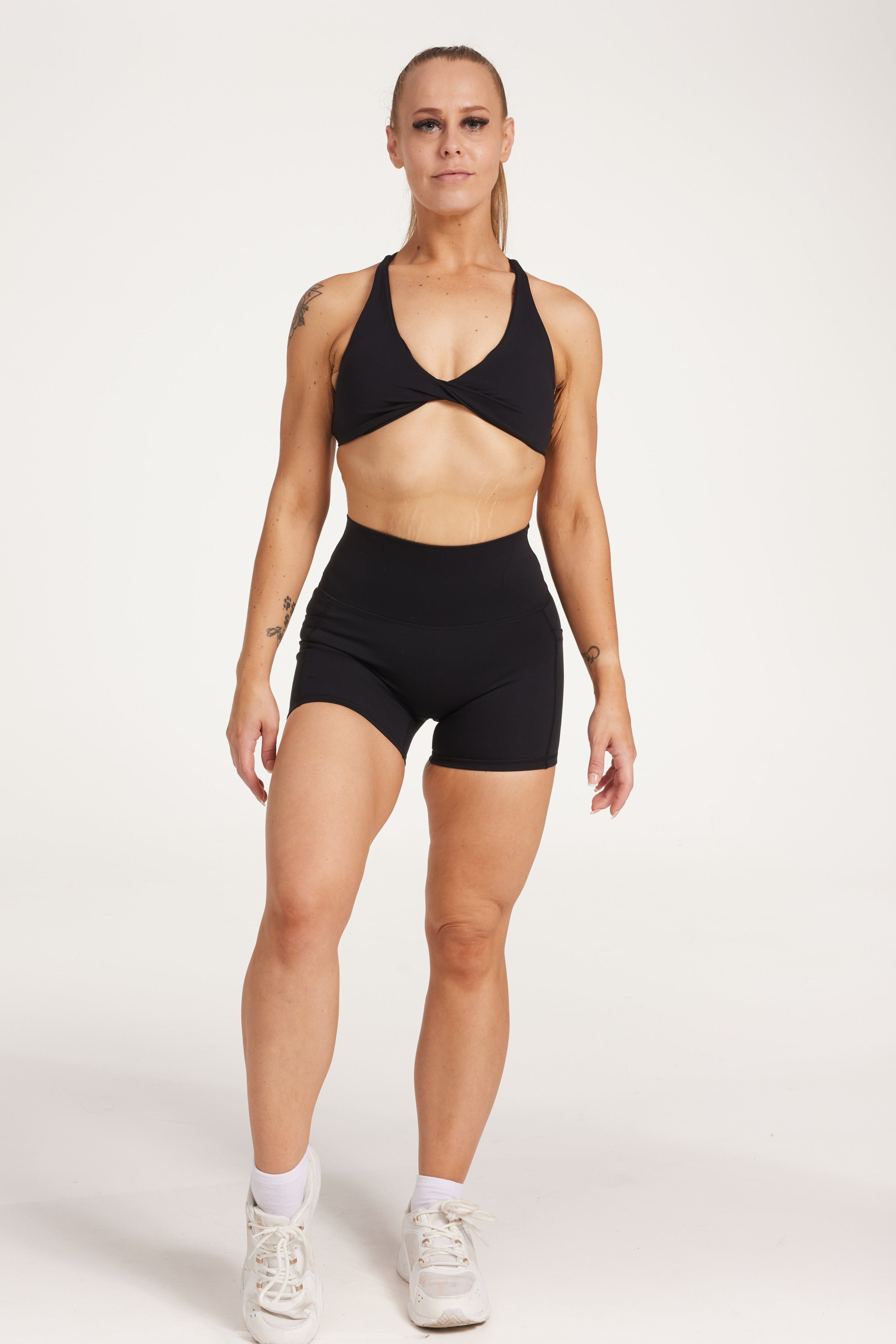 high waisted 4" inseam activewear shorts with no front rise seam, in a buttery soft, supportive fabric with twist front bra and cross over back straps