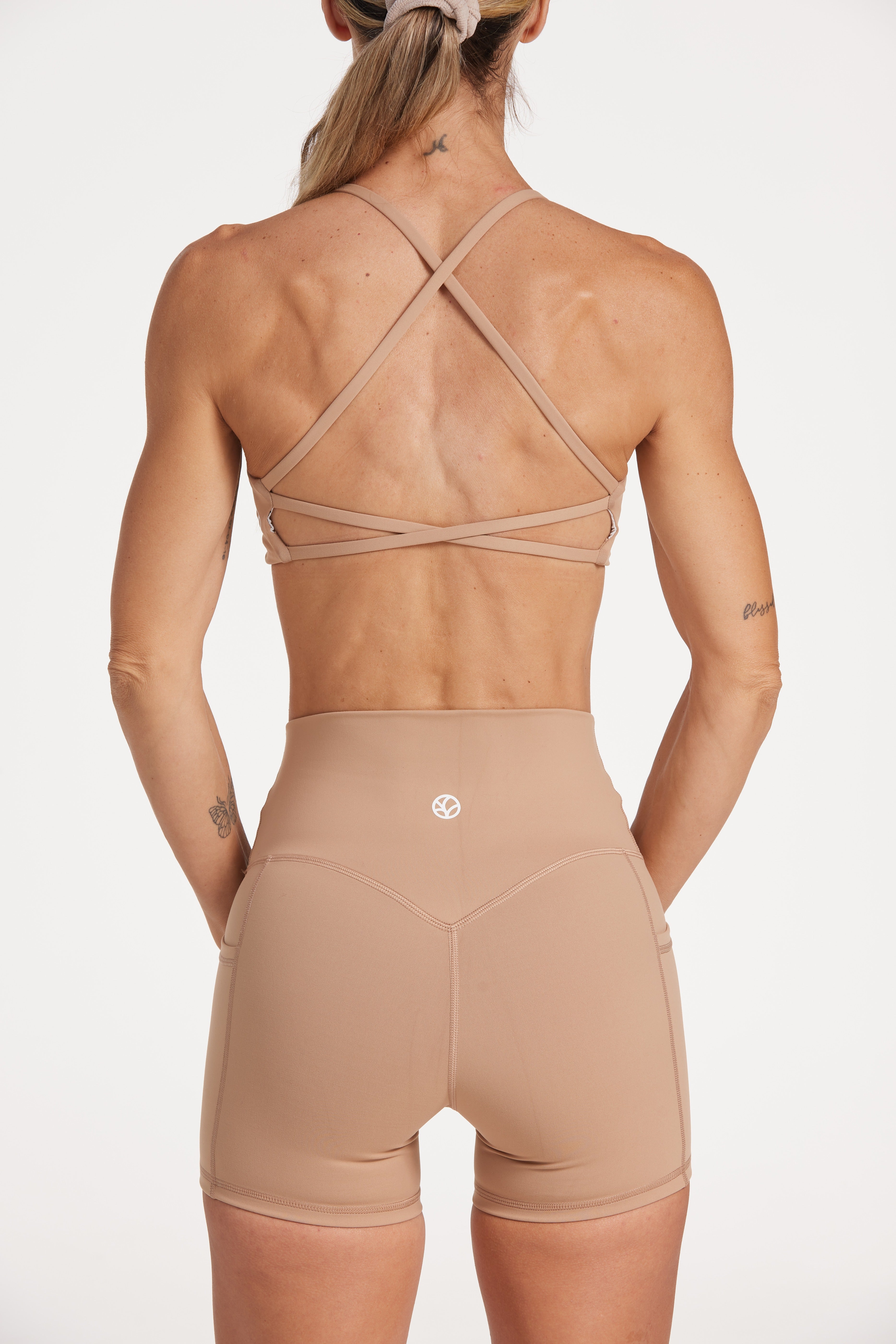 twist front bra with cross over back straps in a buttery soft fabric in a light taupe colour