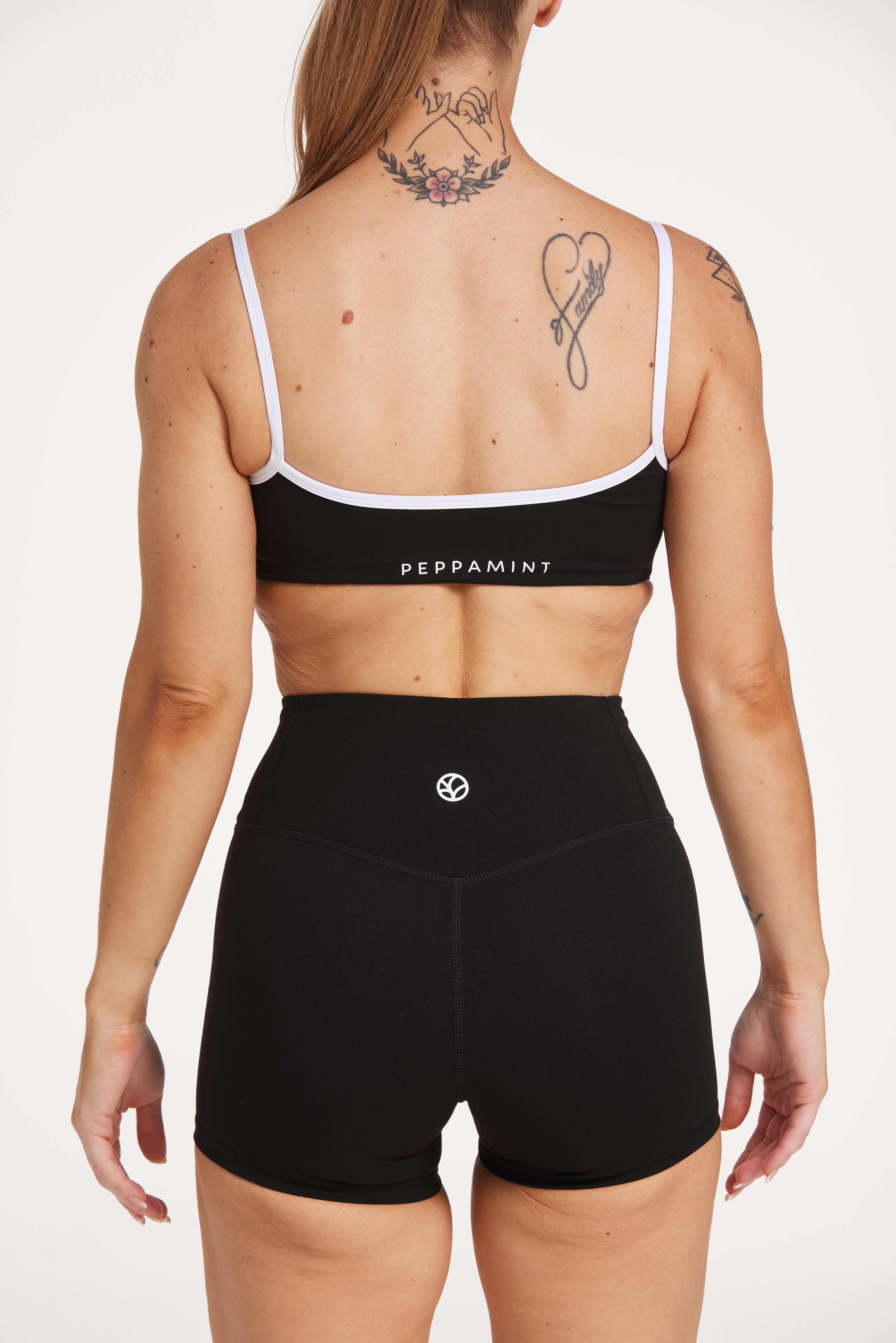 womens high waisted shorts with white trim details, no front rise seam in a buttery soft, in black fabric
