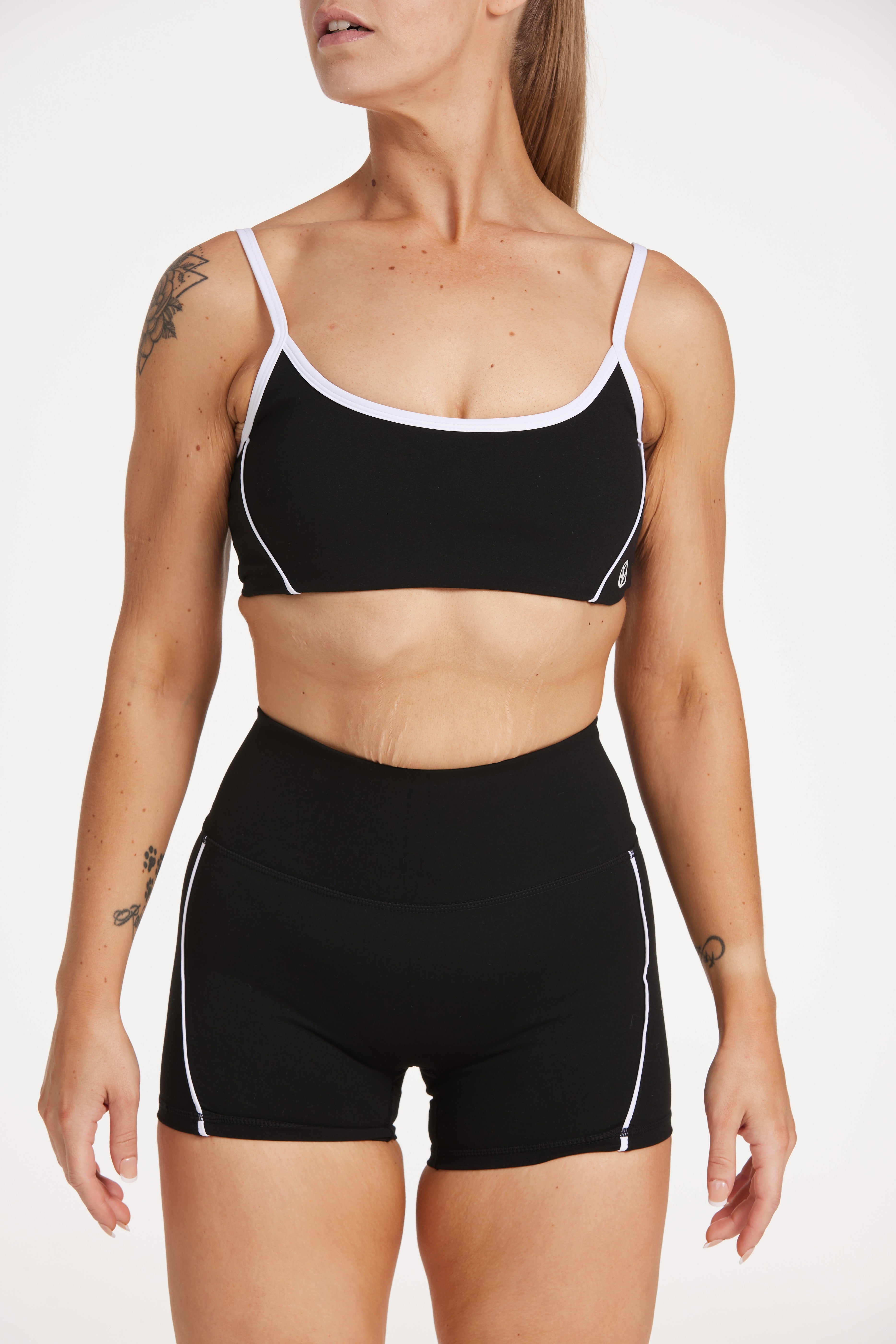 womens high waisted shorts with white trim details, no front rise seam in a buttery soft, in black fabric