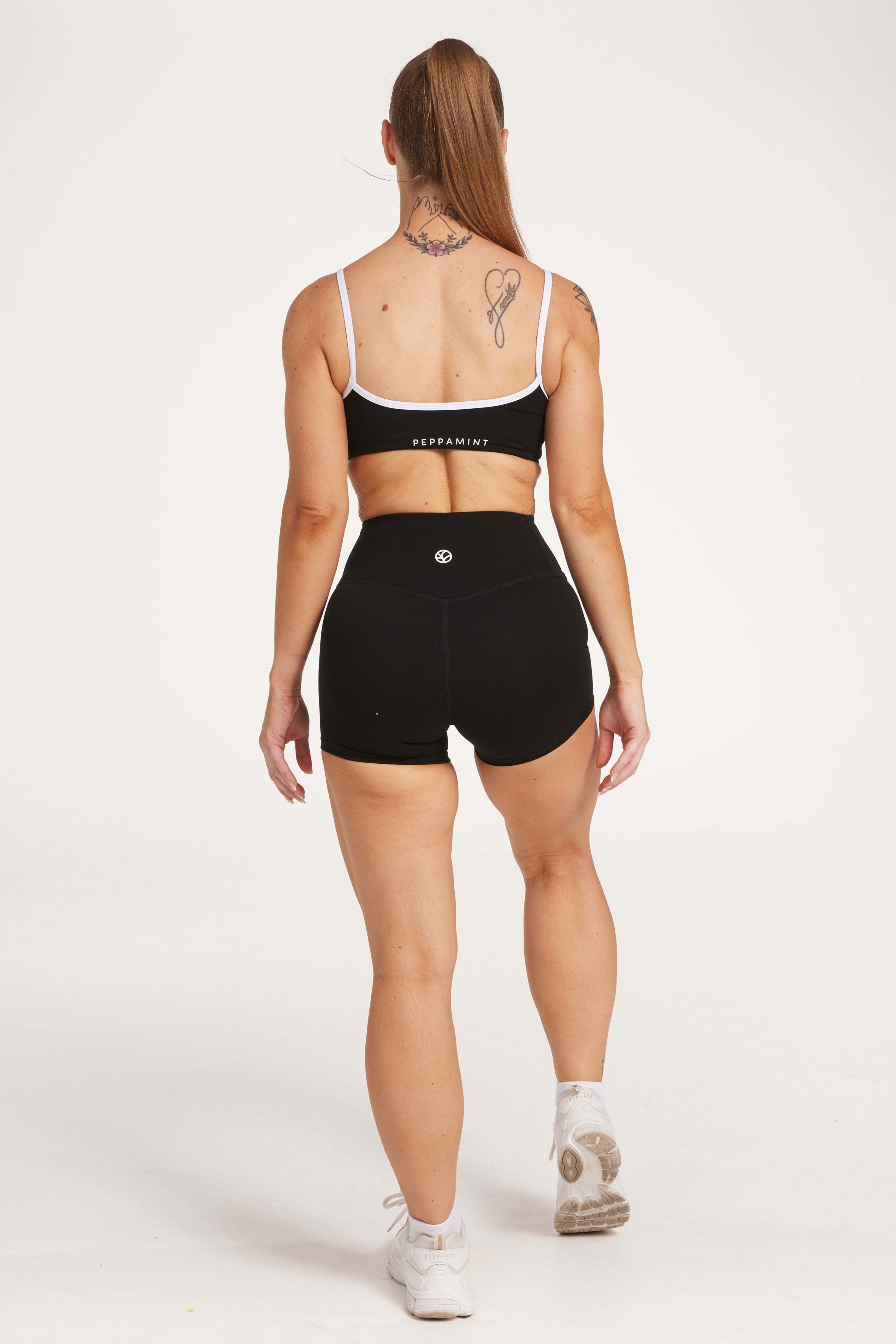 womens high waisted shorts with white trim details, no front rise seam in a buttery soft, in black fabric