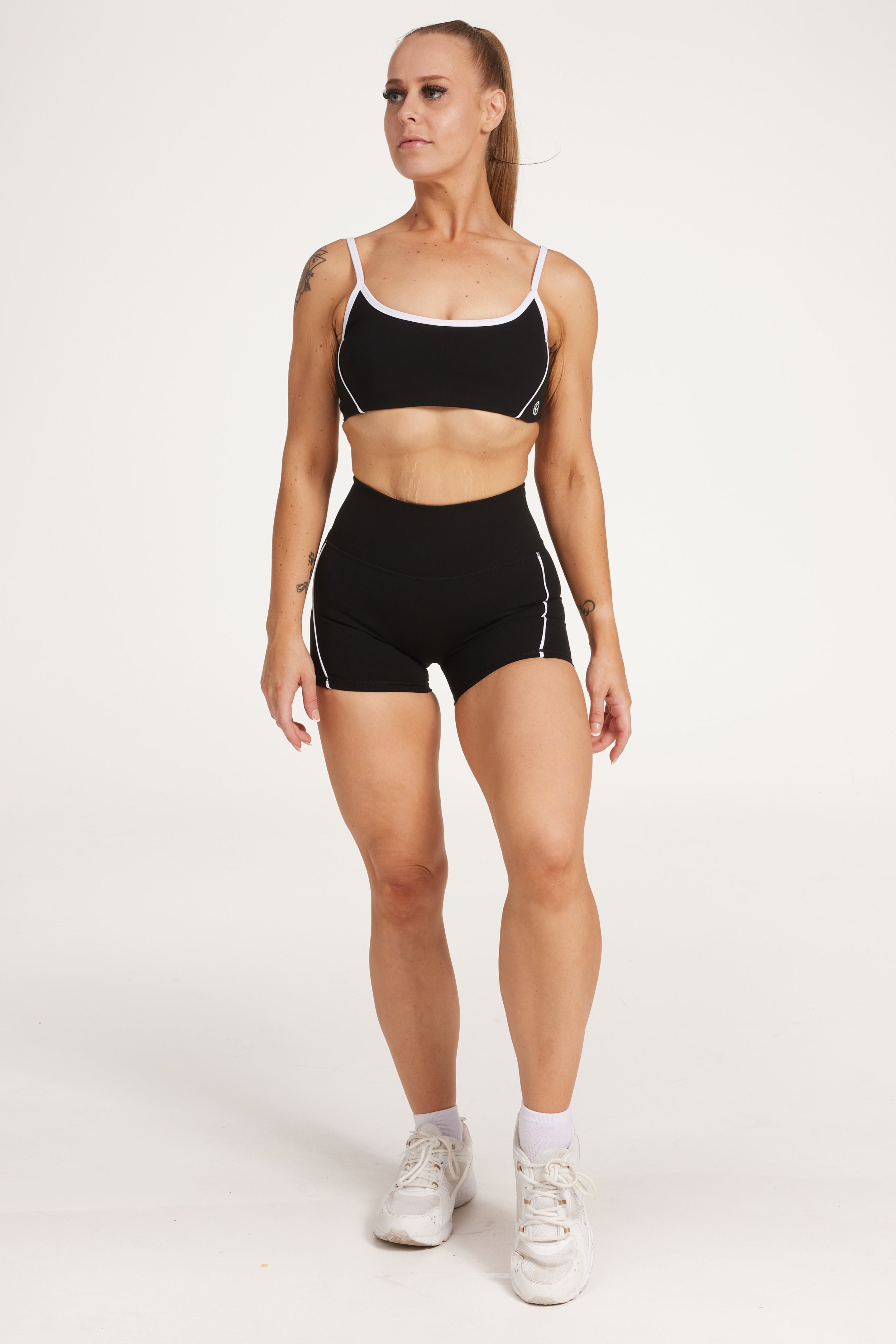 womens high waisted shorts with white trim details, no front rise seam in a buttery soft, in black fabric