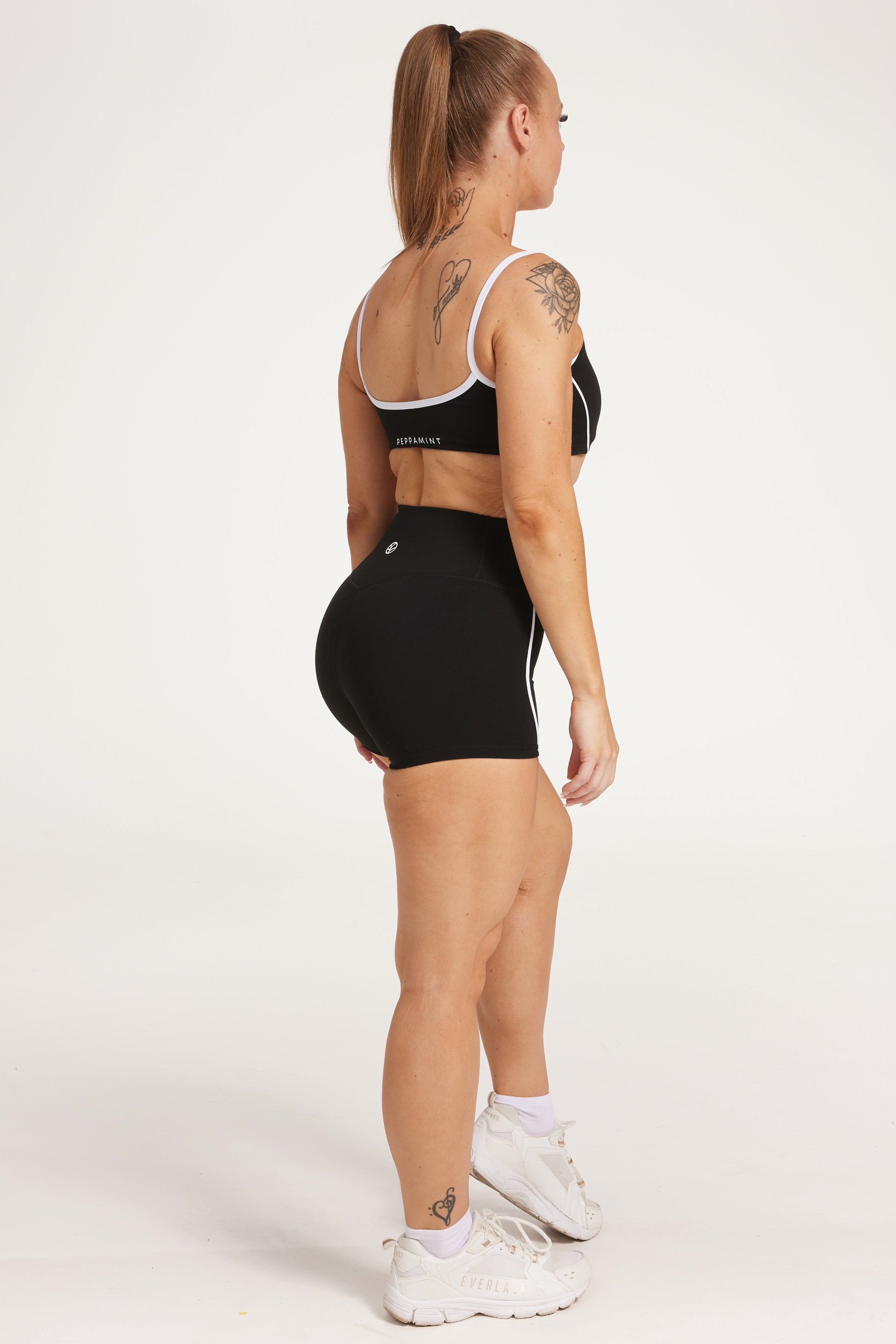 womens high waisted shorts with white trim details, no front rise seam in a buttery soft, in black fabric