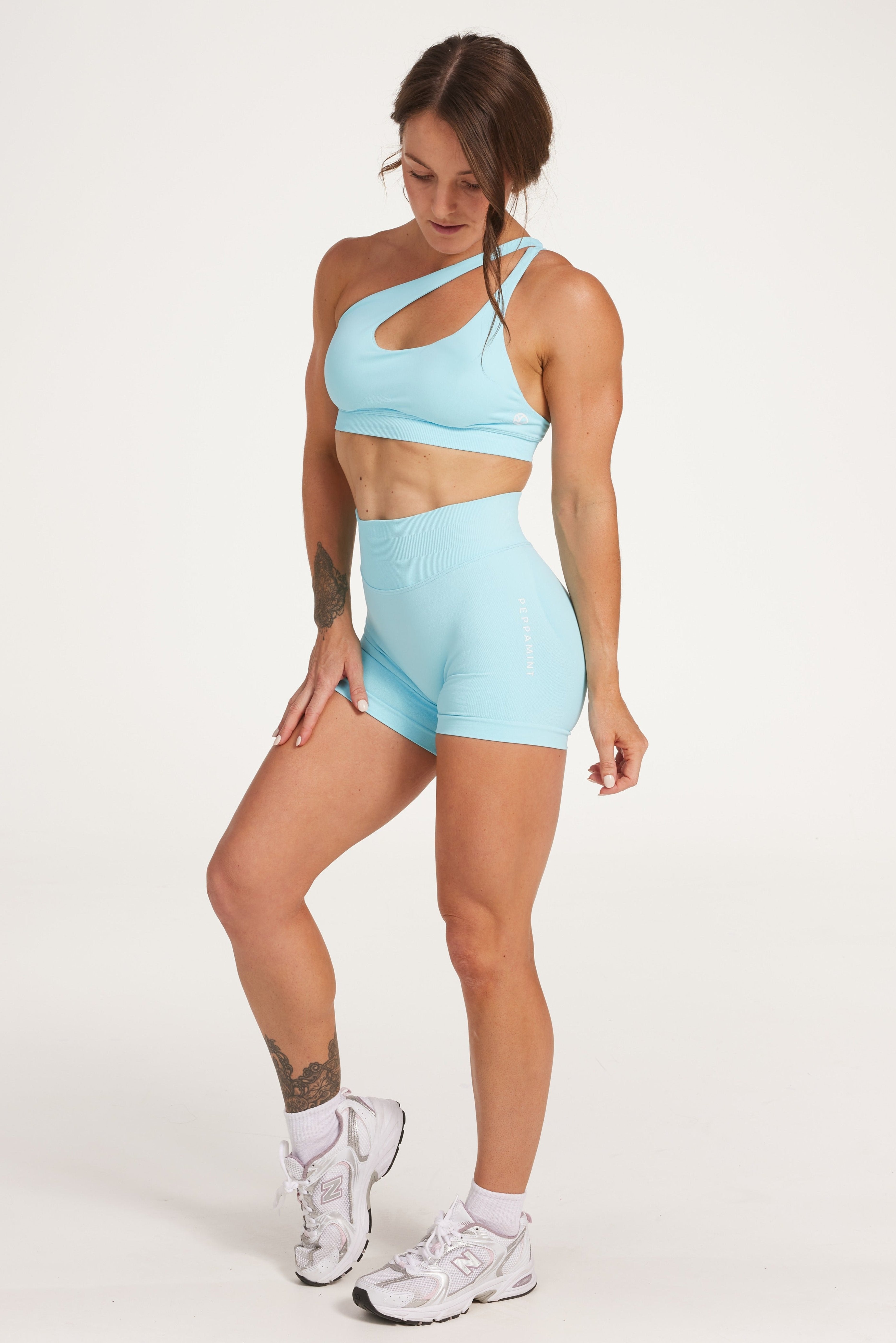 Seamless shorts with booty contouring panels, a thick supportive waistband in ice blue