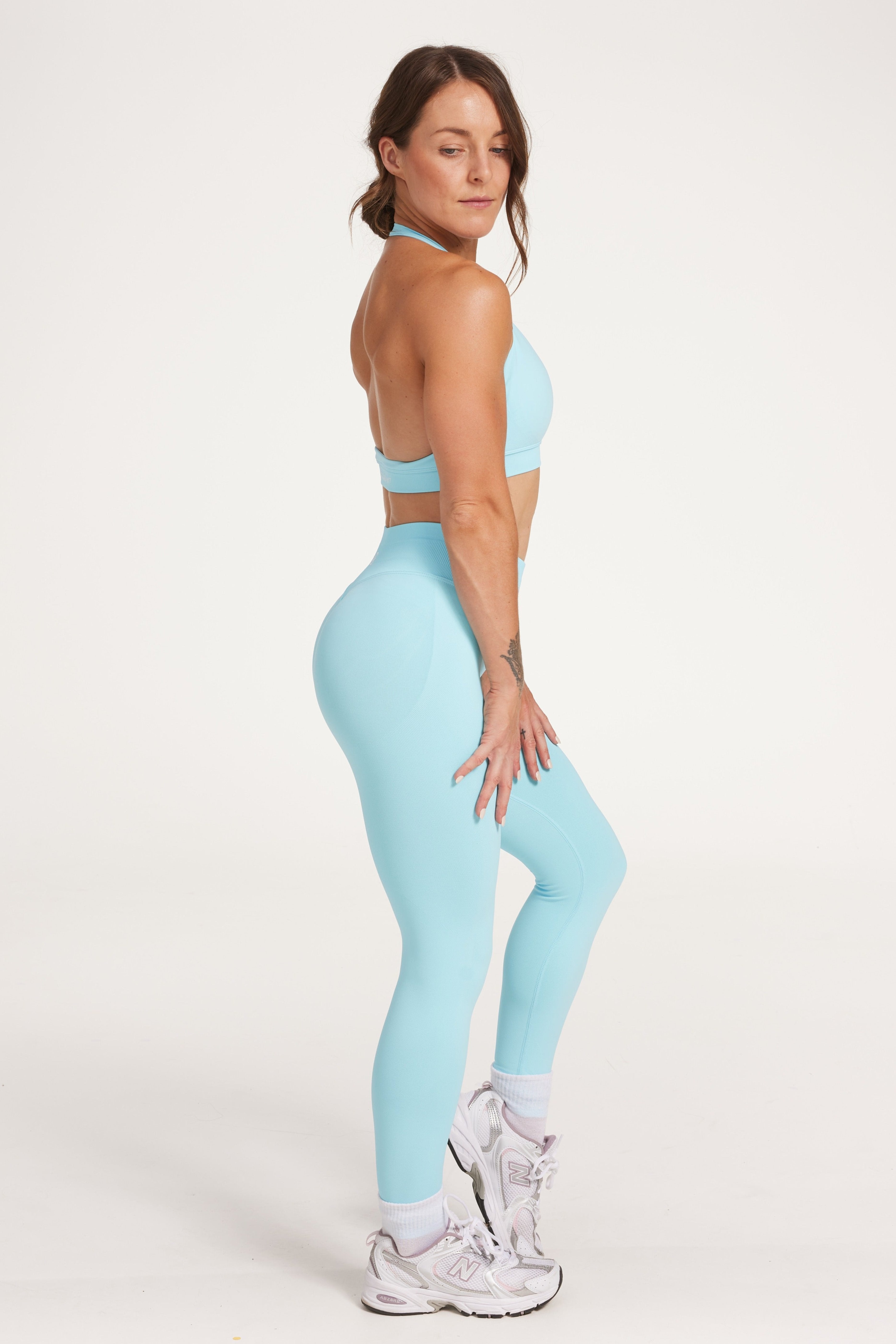 seamless gym tights with booty contouring effect, sweetheart butt seams and thick supportive fabric in ice blue