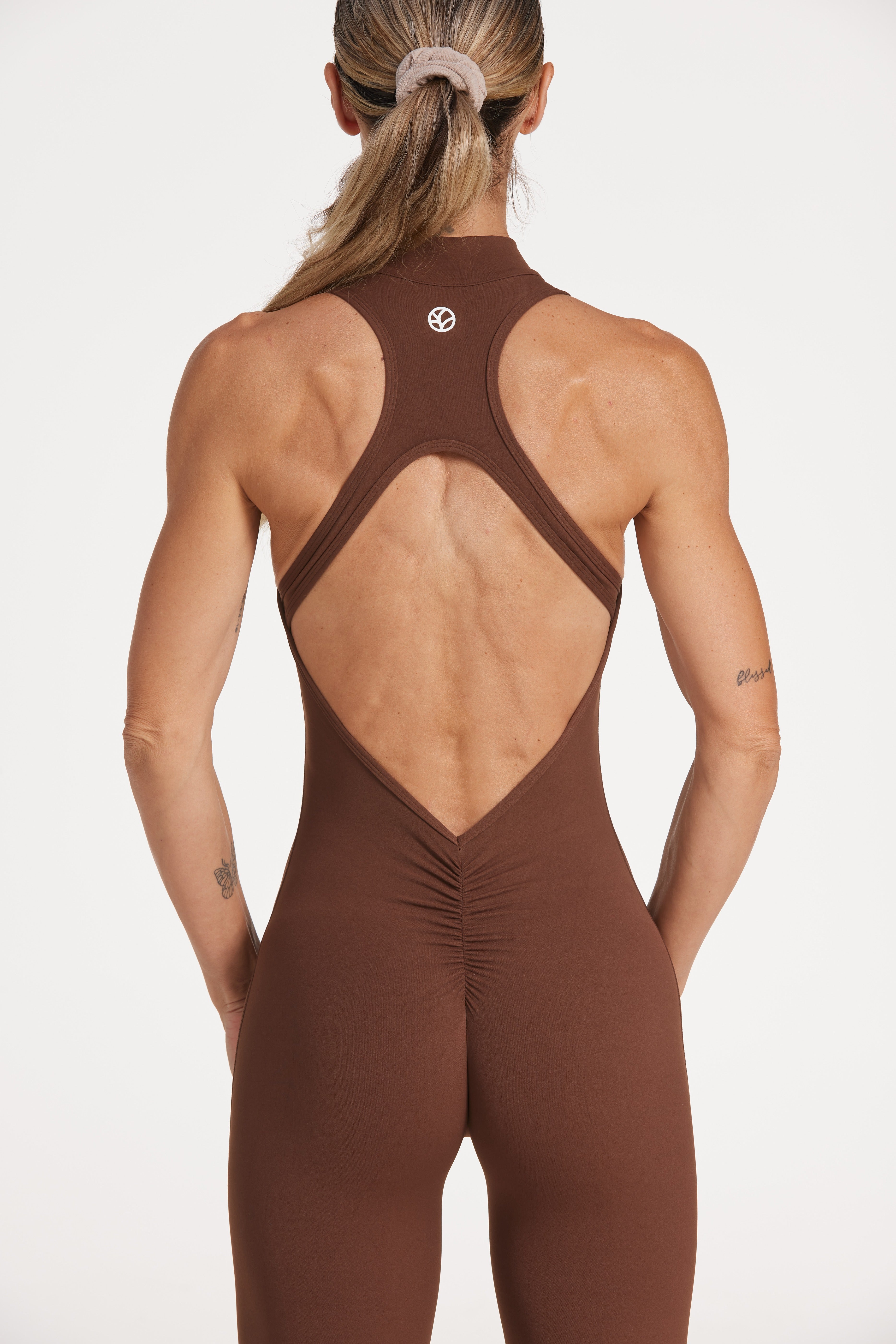full leg length bodysuit in buttery soft fabric with half zipper, high neck design, scrunch butt, and open back detail.