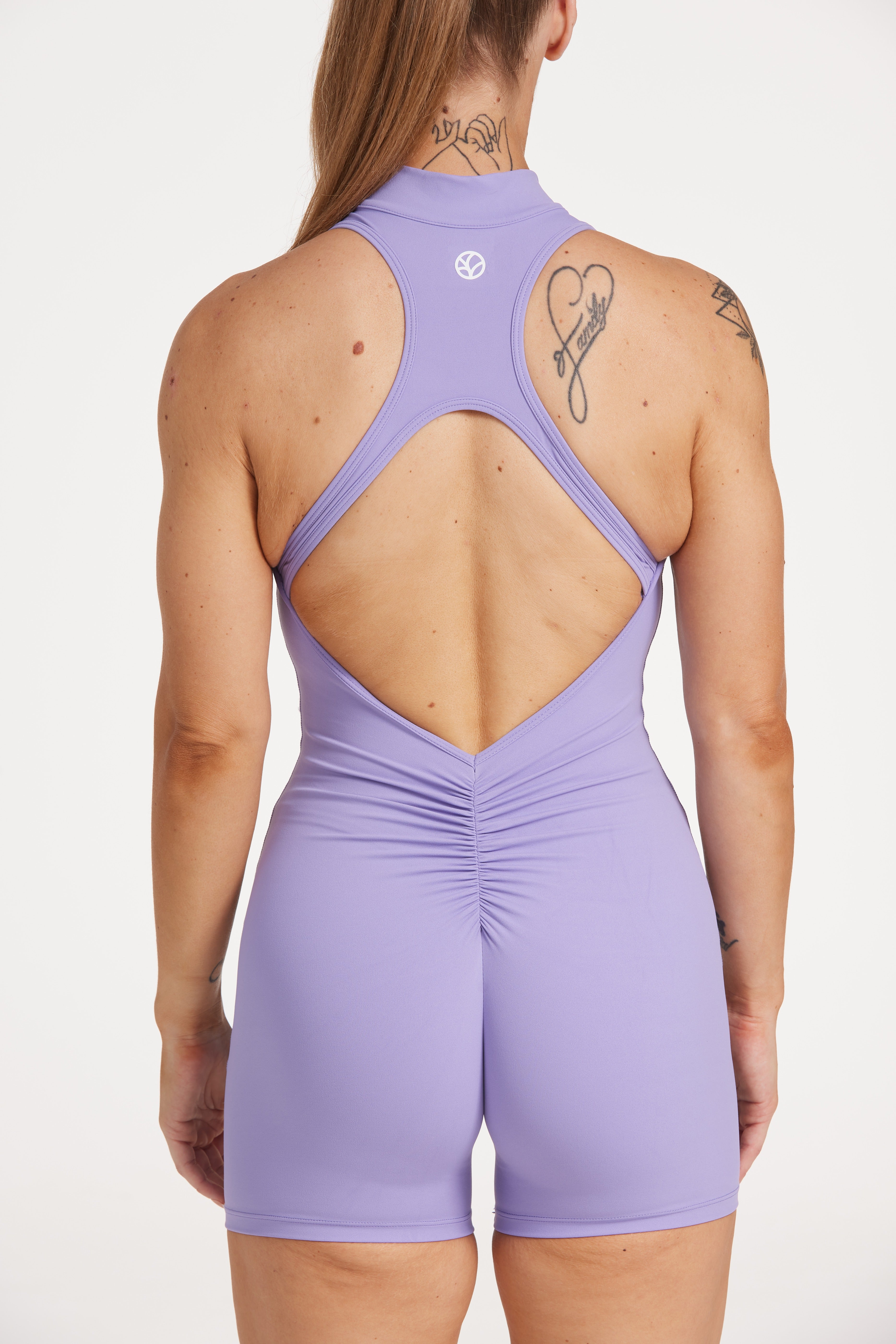 High neck bodysuit with half zipper, scrunch bum detailing, in short length made from a buttery soft flexible fabric in lavender