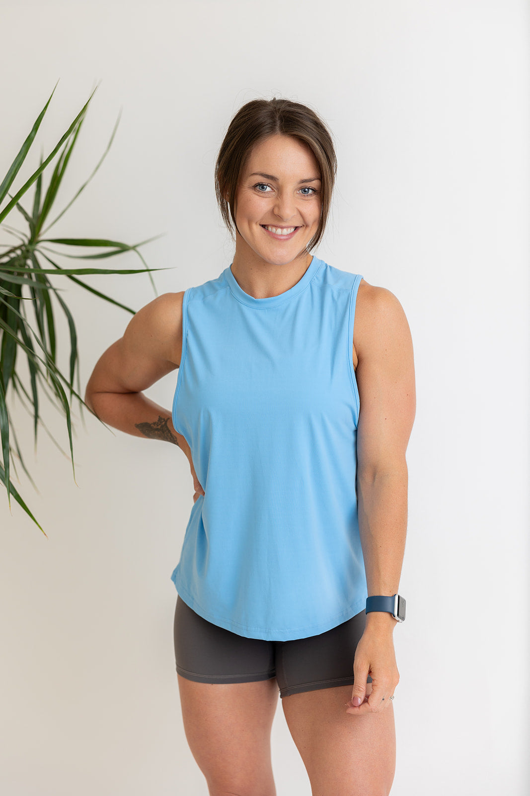 buttery soft tank top in baby blue with subtle stitched logo tag