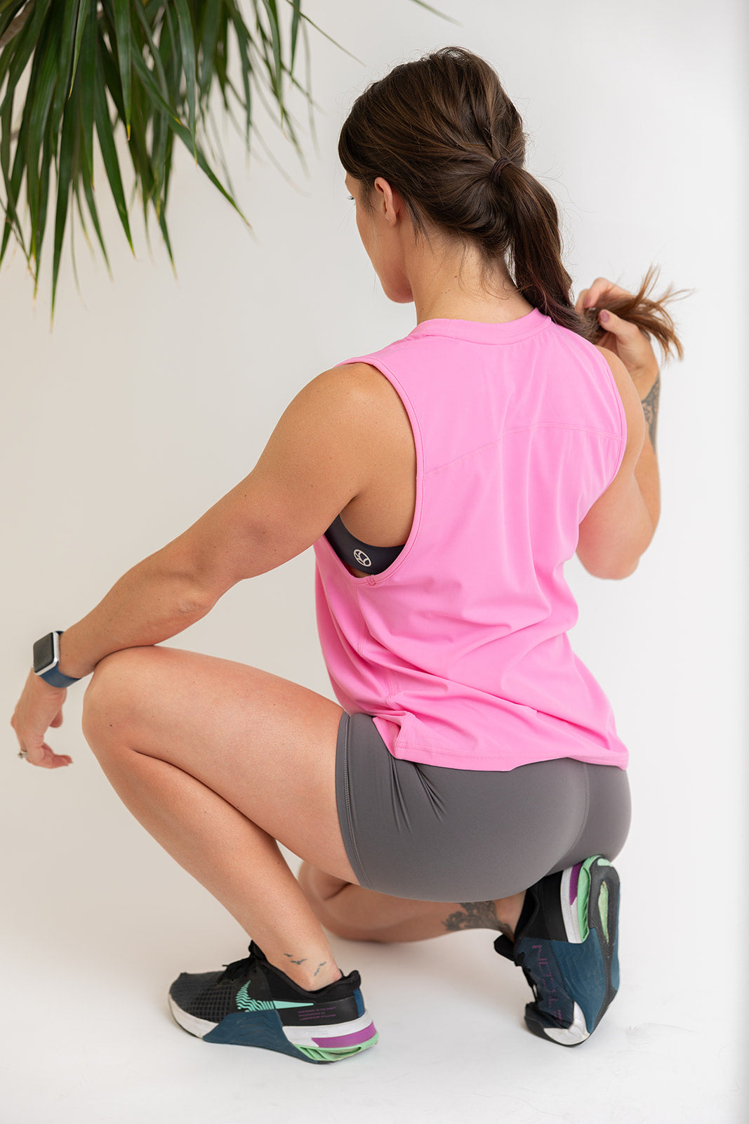 buttery soft tank top in baby pink with subtle stitched logo tag