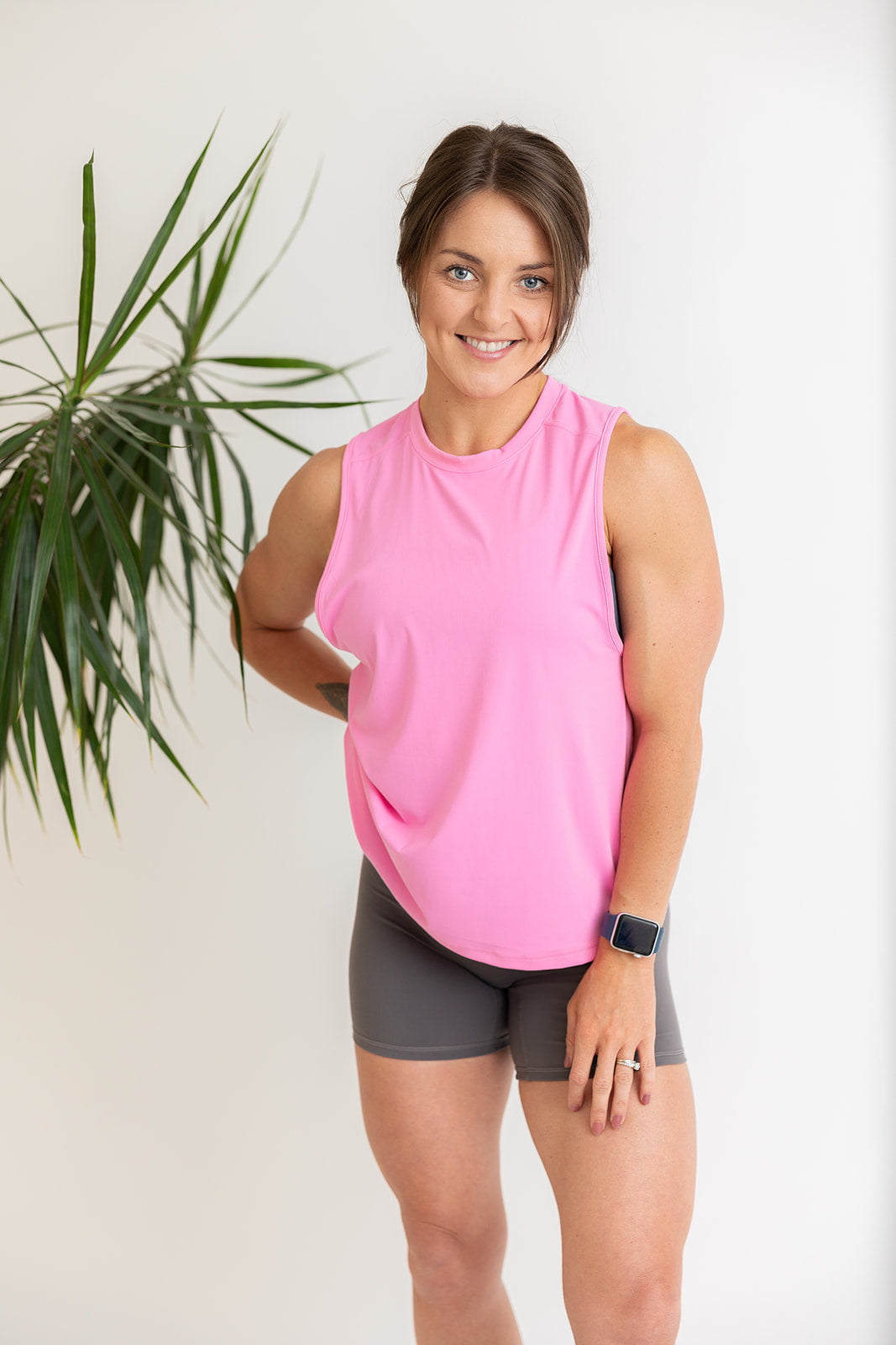 buttery soft tank top in baby pink with subtle stitched logo tag