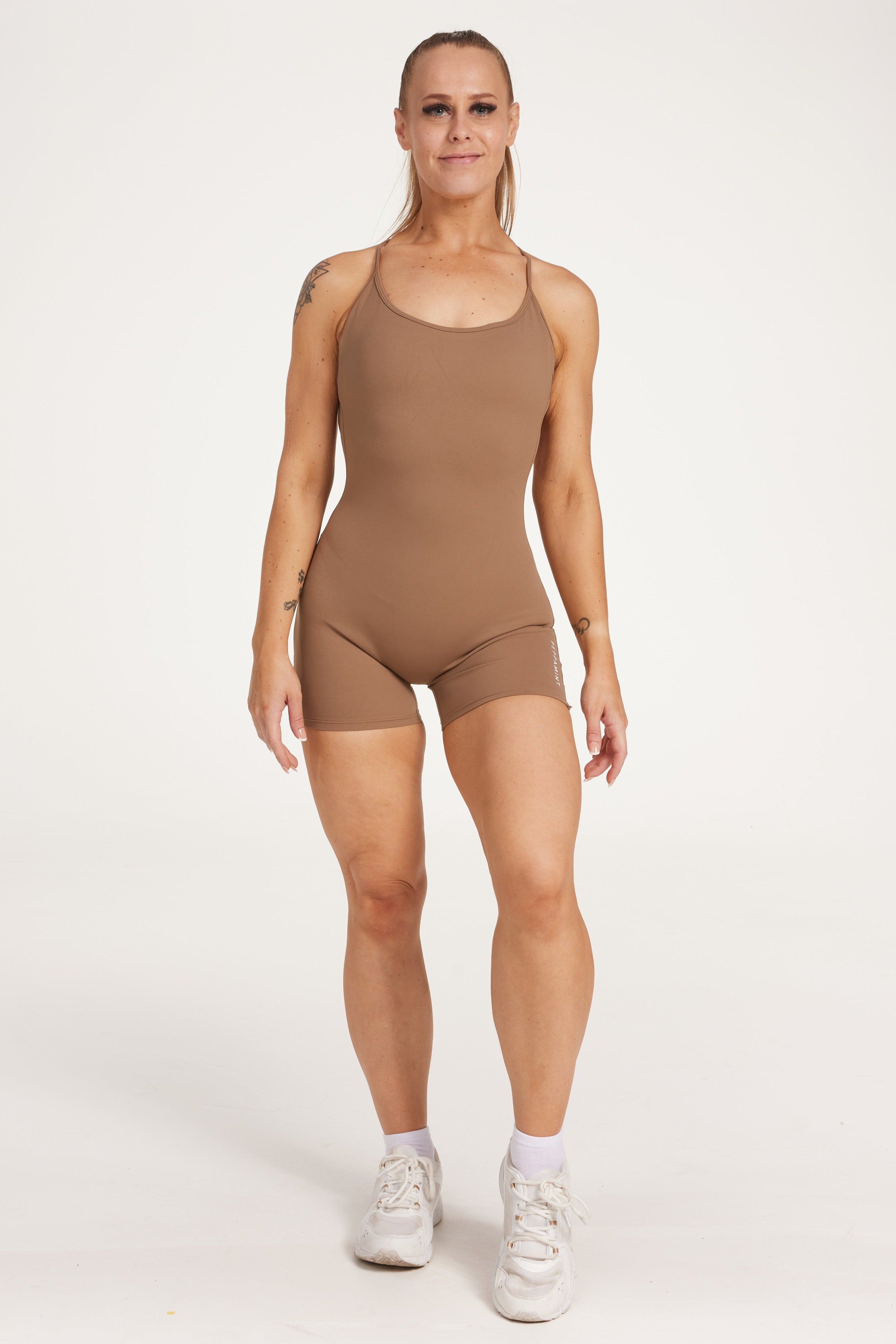 Womens bodysuit with scoop neck design, sleek adjustable cross over back straps scrunch butt effect in a buttery soft breathable fabric