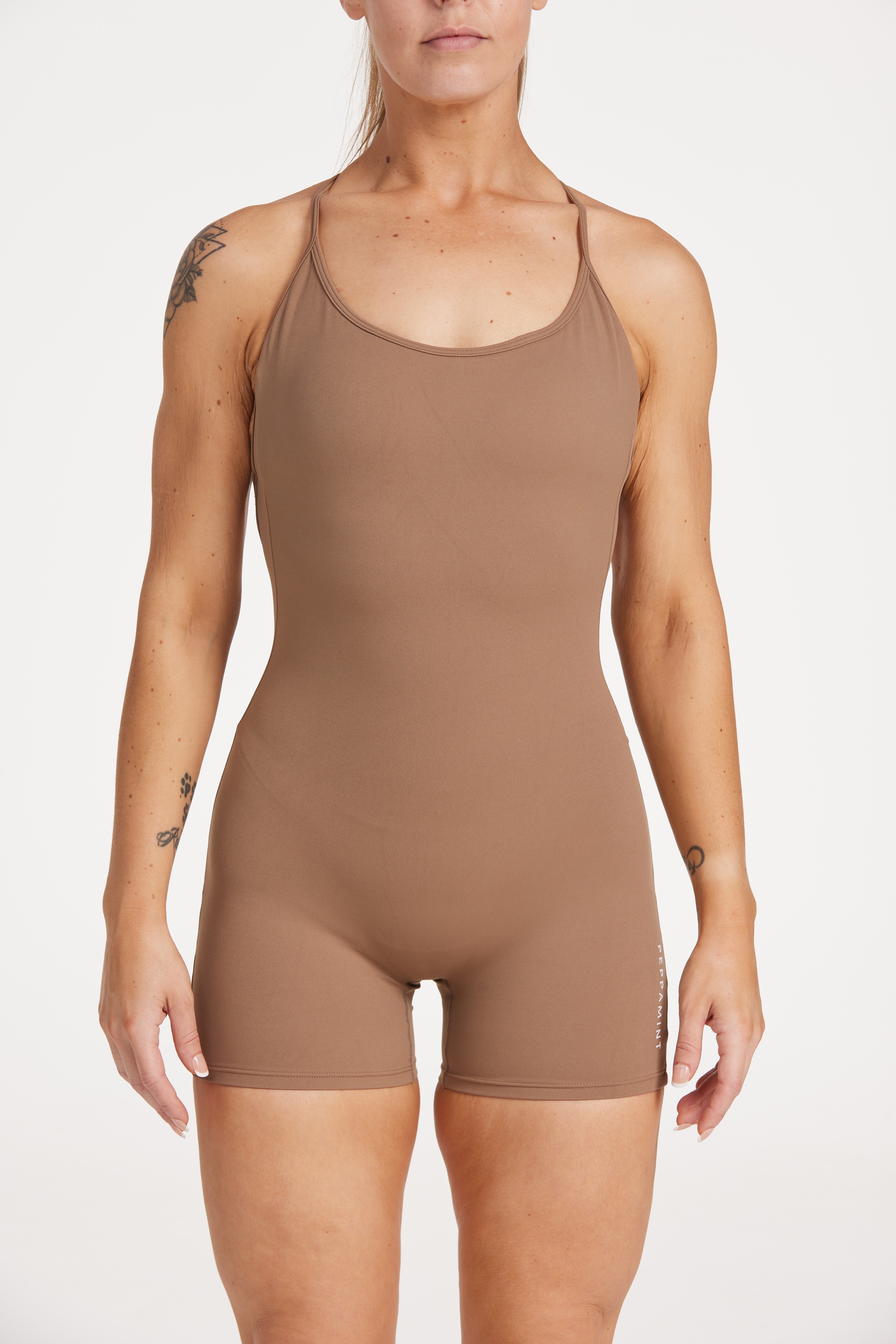 Womens bodysuit with scoop neck design, sleek adjustable cross over back straps scrunch butt effect in a buttery soft breathable fabric