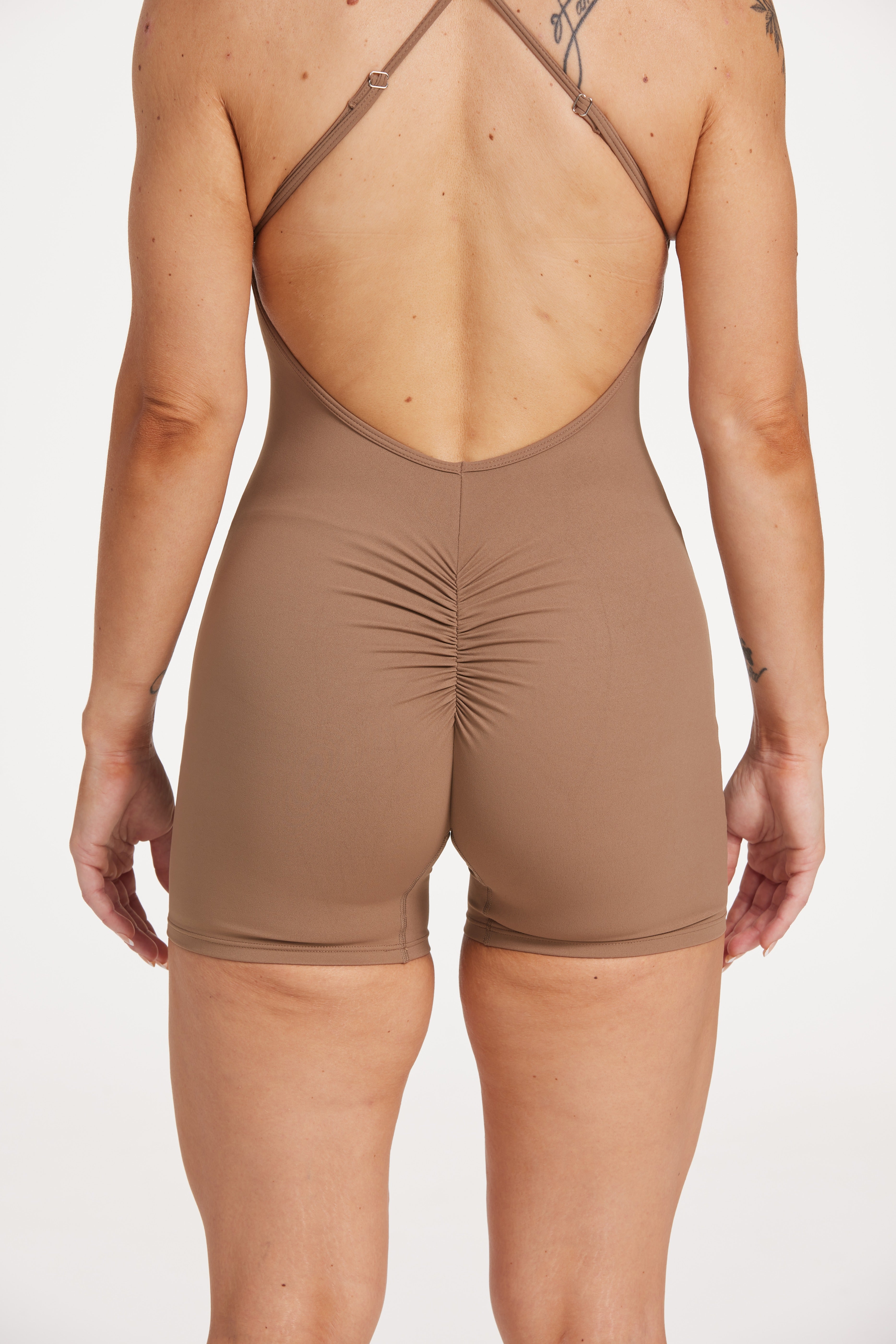 Womens bodysuit with scoop neck design, sleek adjustable cross over back straps scrunch butt effect in a buttery soft breathable fabric