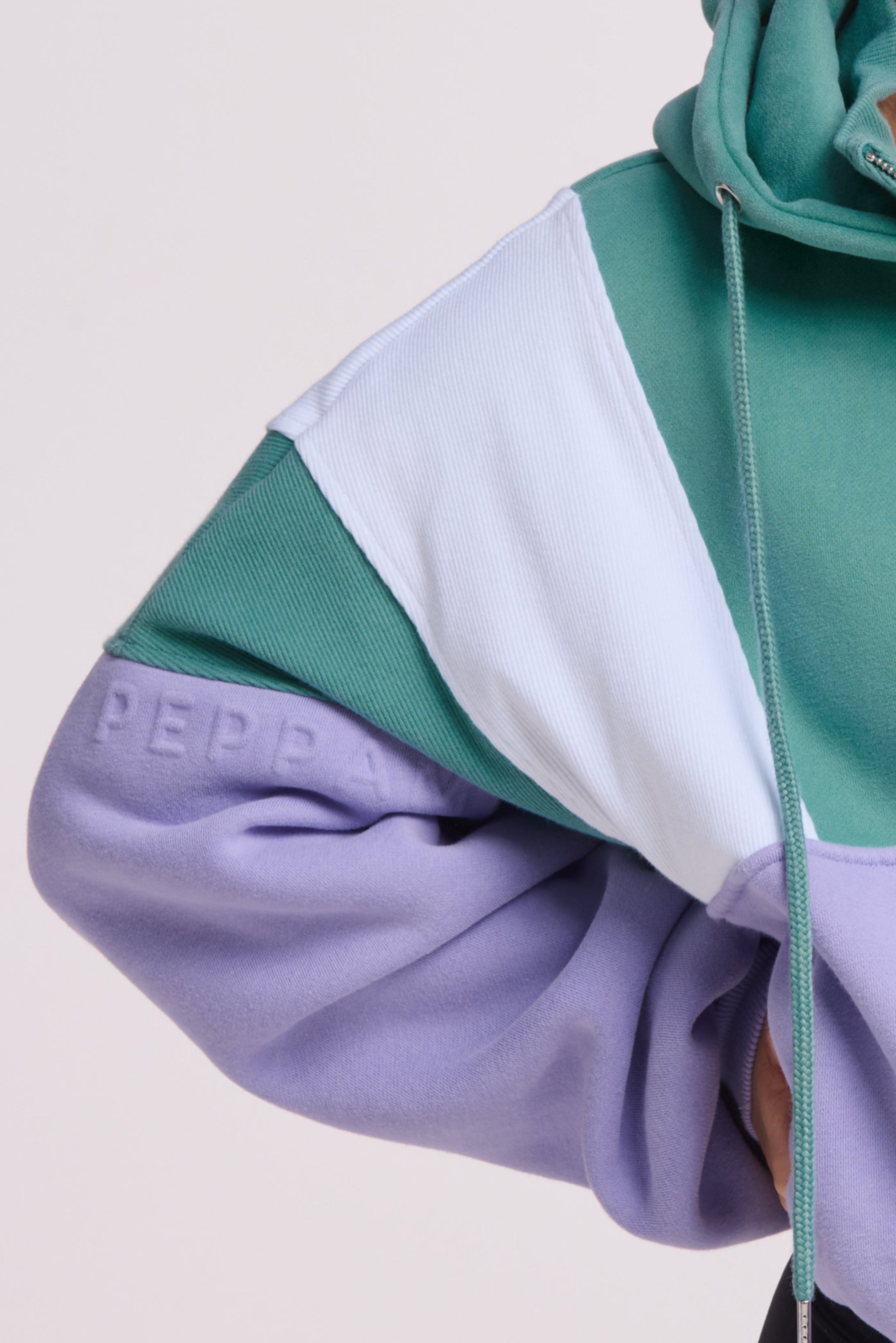 Hip length, full zip hoodie, with ribbed panels, embossed sleeve logo, in a slouchy oversize fit, in green, lavender and white.