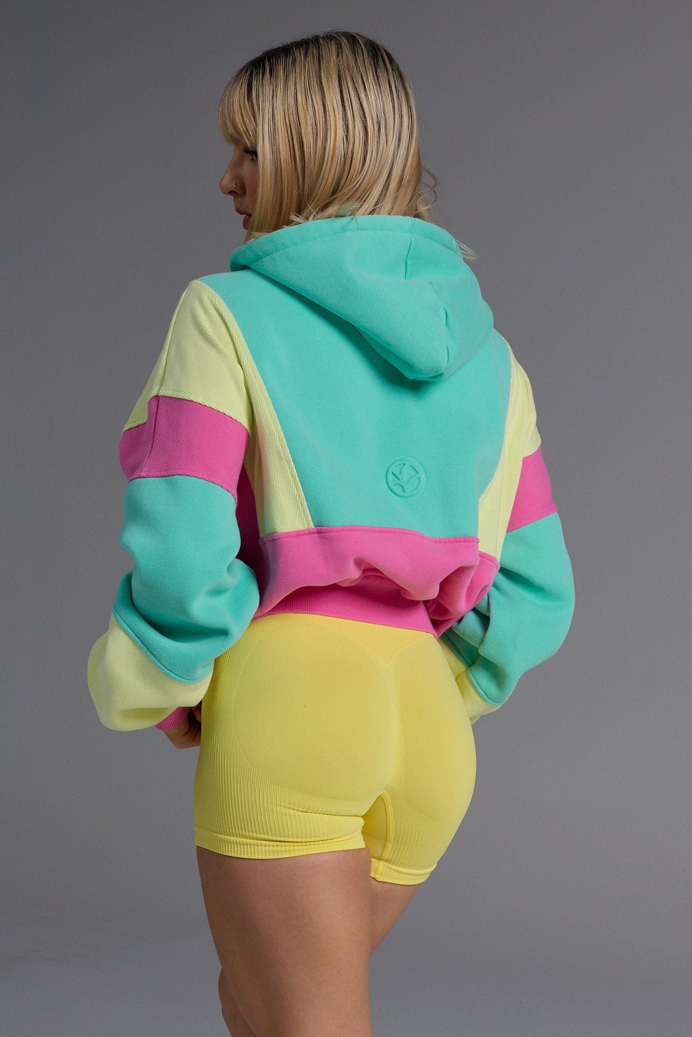 Hip length, full zip hoodie, with ribbed panels, embossed sleeve logo, in a slouchy oversize fit, with 2 convenient zip pockets, in neon pink, green and yellow.