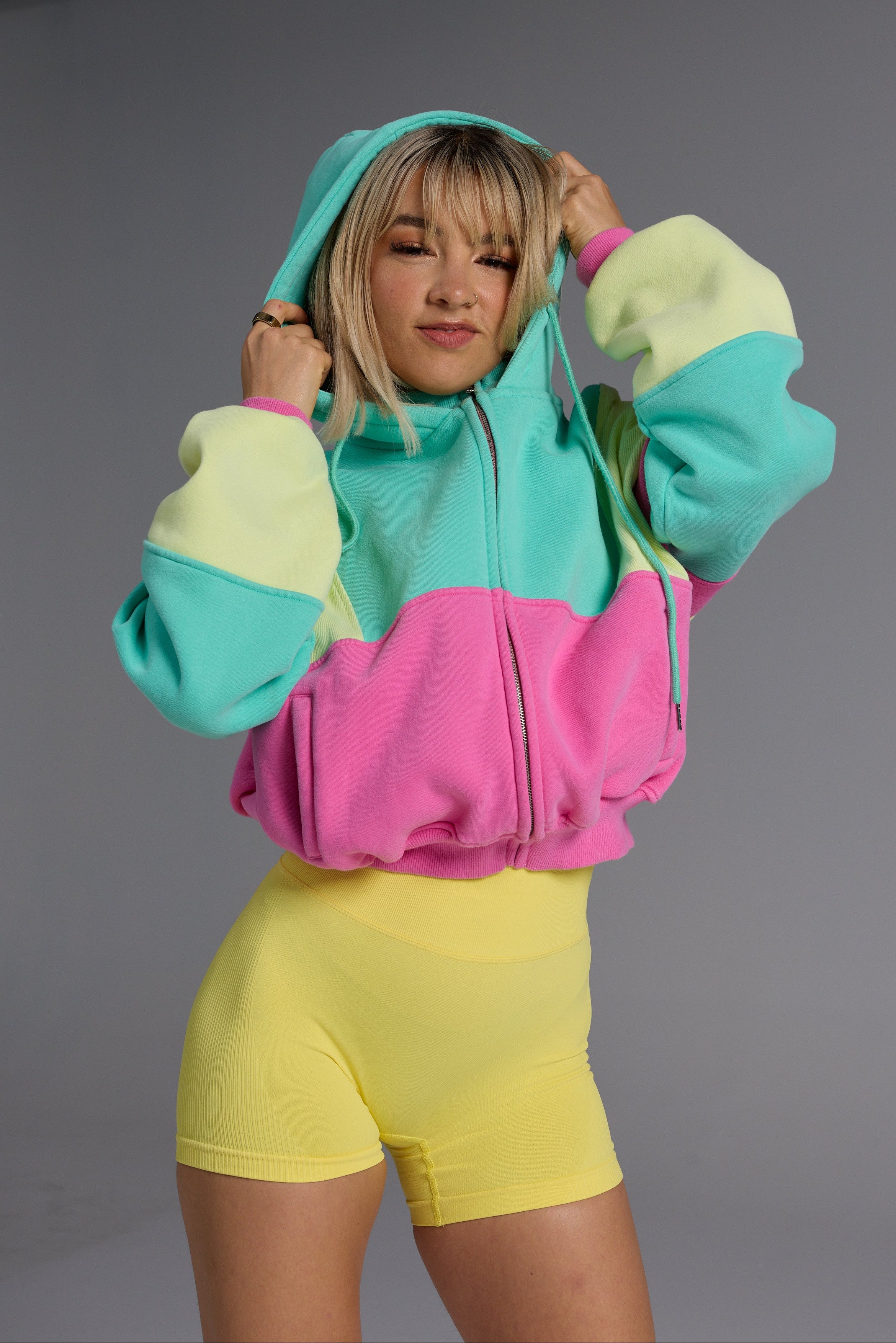 Hip length, full zip hoodie, with ribbed panels, embossed sleeve logo, in a slouchy oversize fit, with 2 convenient zip pockets, in neon pink, green and yellow.