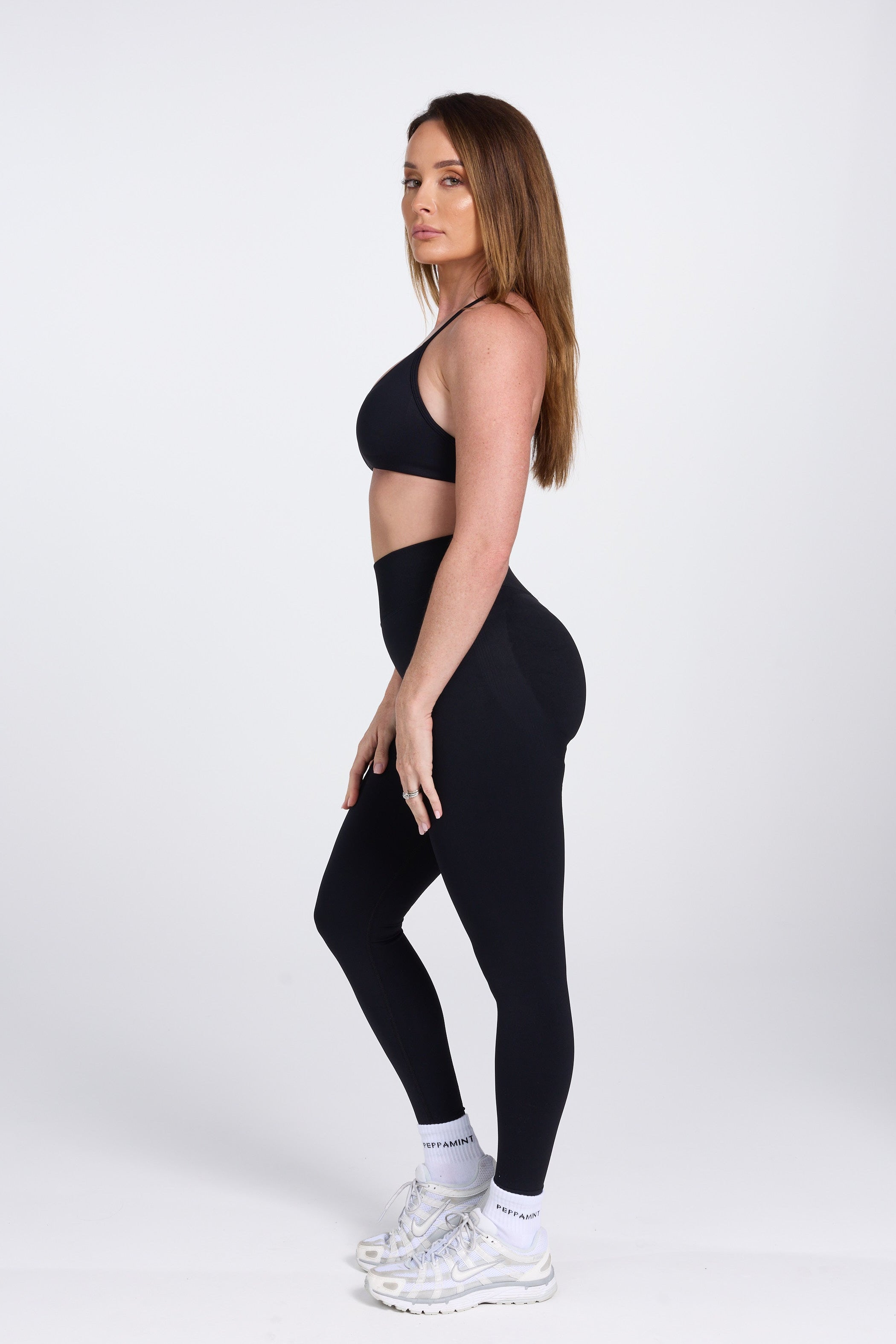 Seamless high waisted gym tights with booty contouring panels, invisible scrunch technology, sweetheart shaped back seams and thick supportive fabric in black