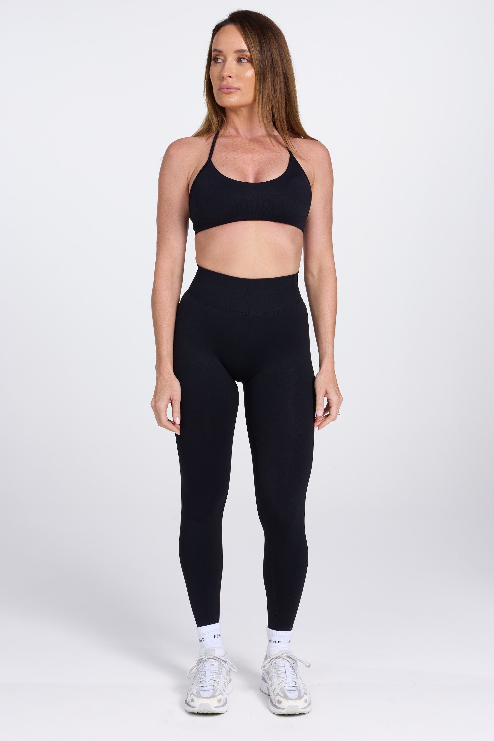 Seamless high waisted gym tights with booty contouring panels, invisible scrunch technology, sweetheart shaped back seams and thick supportive fabric in black