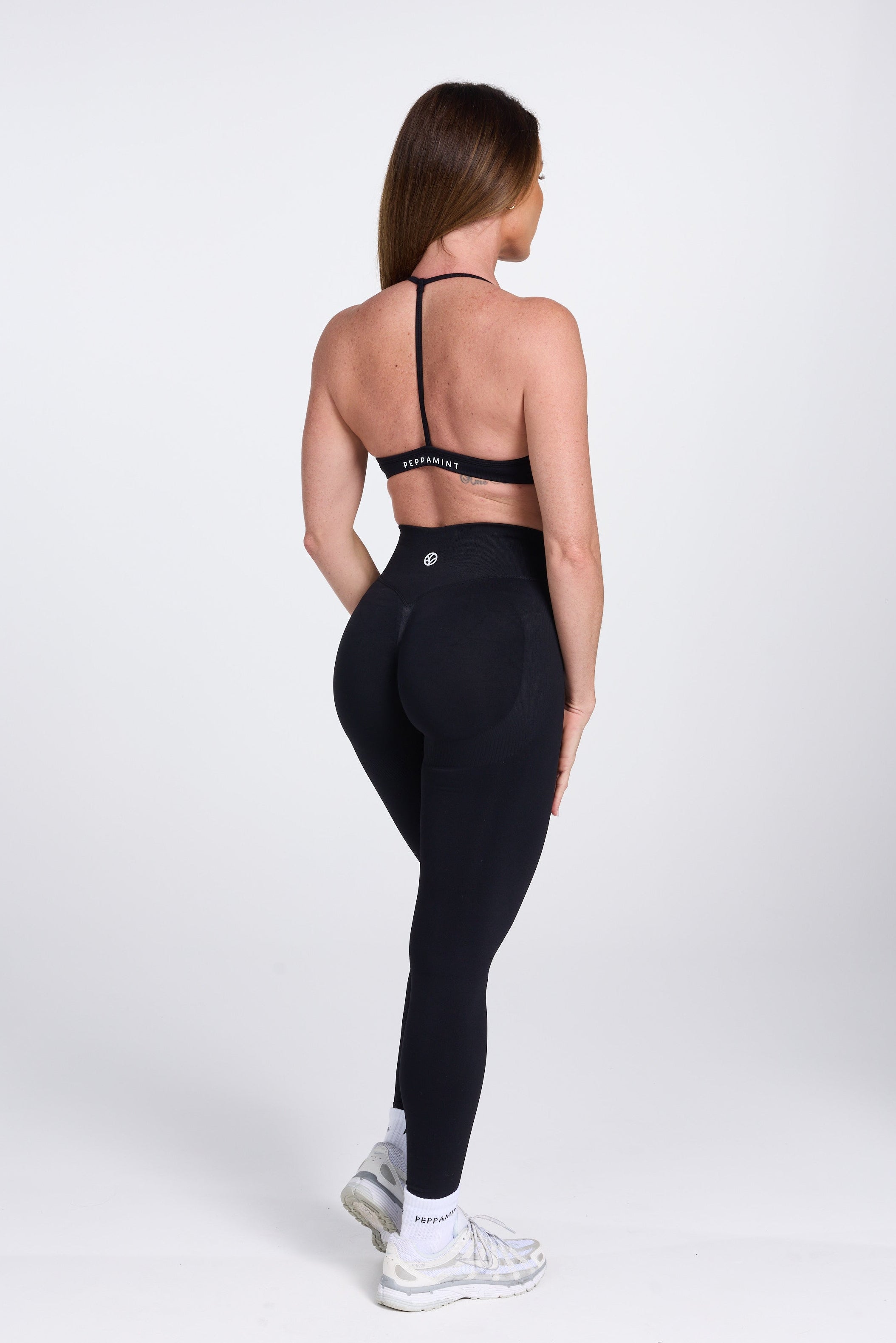 Seamless high waisted gym tights with booty contouring panels, invisible scrunch technology, sweetheart shaped back seams and thick supportive fabric in black