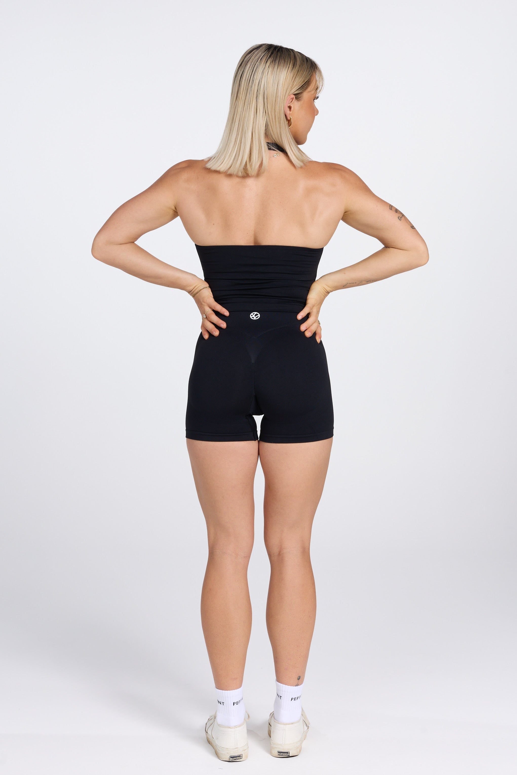 Seamless halter neck tank top, with supportive built in bra, U neck design and open back, with PEPPAMINT centre chest branding in black