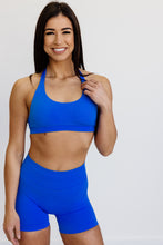 Load image into Gallery viewer, Seamless shorts with booty contouring panels, a thick supportive waistband in royal blue
