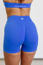 Load image into Gallery viewer, Seamless shorts with booty contouring panels, a thick supportive waistband in royal blue
