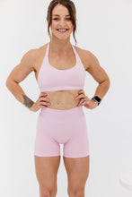 Load image into Gallery viewer, Seamless shorts with booty contouring panels, a thick supportive waistband in peony pink
