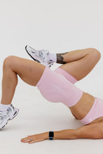 Load image into Gallery viewer, Seamless shorts with booty contouring panels, a thick supportive waistband in peony pink
