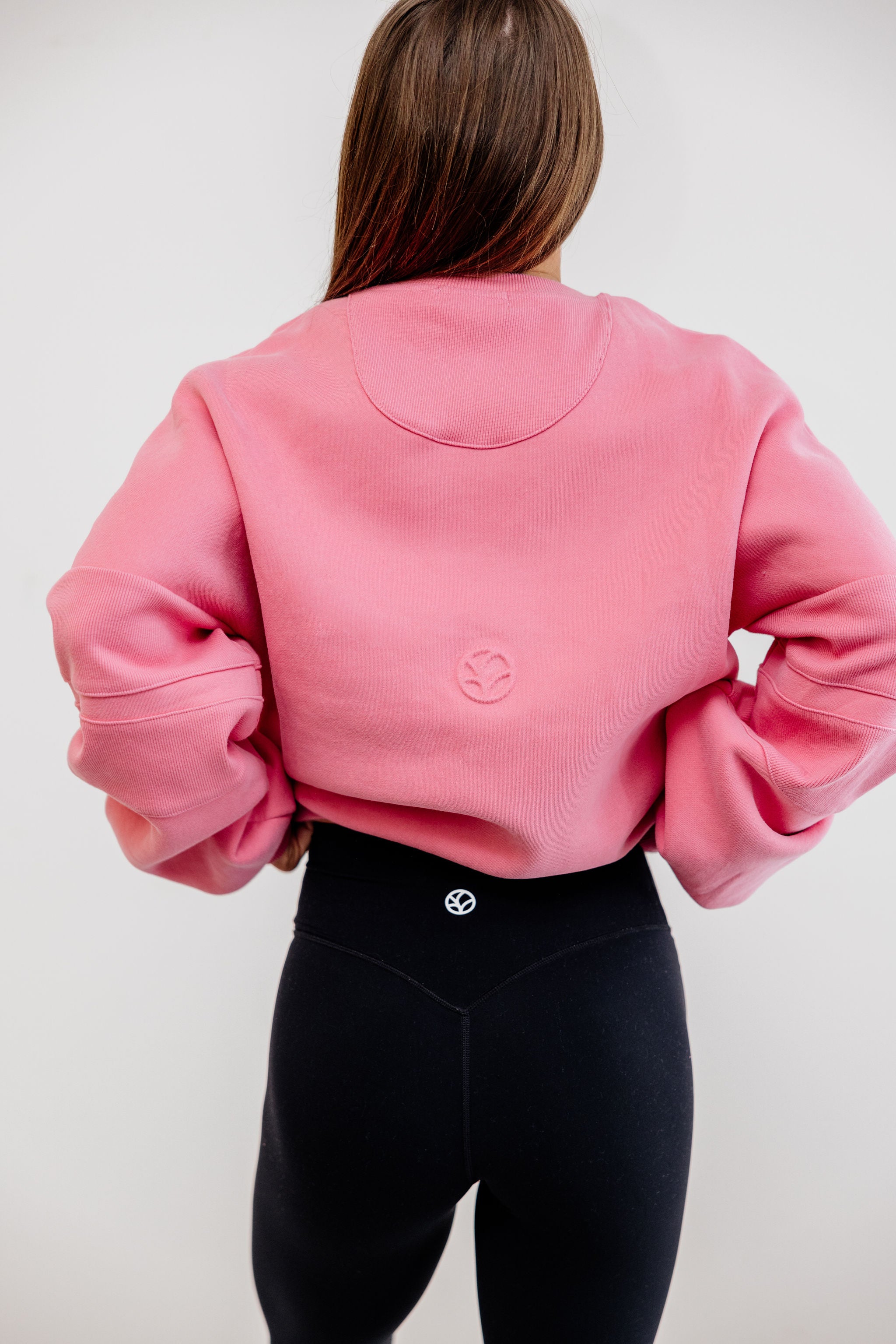 peony pink crew neck jumper with ribbed arm panels in pink with embossed logo breast cancer awareness