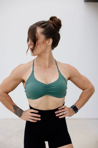 ruched front sports bra in buttery soft fabric with Y back strap and thick band in teal