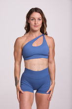 Load image into Gallery viewer, Front cross over strap activewear bra in seamless fabric with adjustable back straps, and ribbed supportive underbust band and seamless gym tights with booty contouring panels, invisible scrunch technology, sweetheart shaped back seams and thick supportive fabric in grey blue colour
