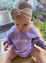 Load image into Gallery viewer, Oversize/Slouch fit baby bodysuit in lavender made of french terry cotton fabric, with white branded Peppamint logo centre chest
