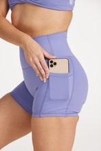 Load image into Gallery viewer, womens high waisted pocket shorts with 4&quot; inseam, no front rise seam, 2 side pockets for convenient storage in a buttery soft lavender fabric
