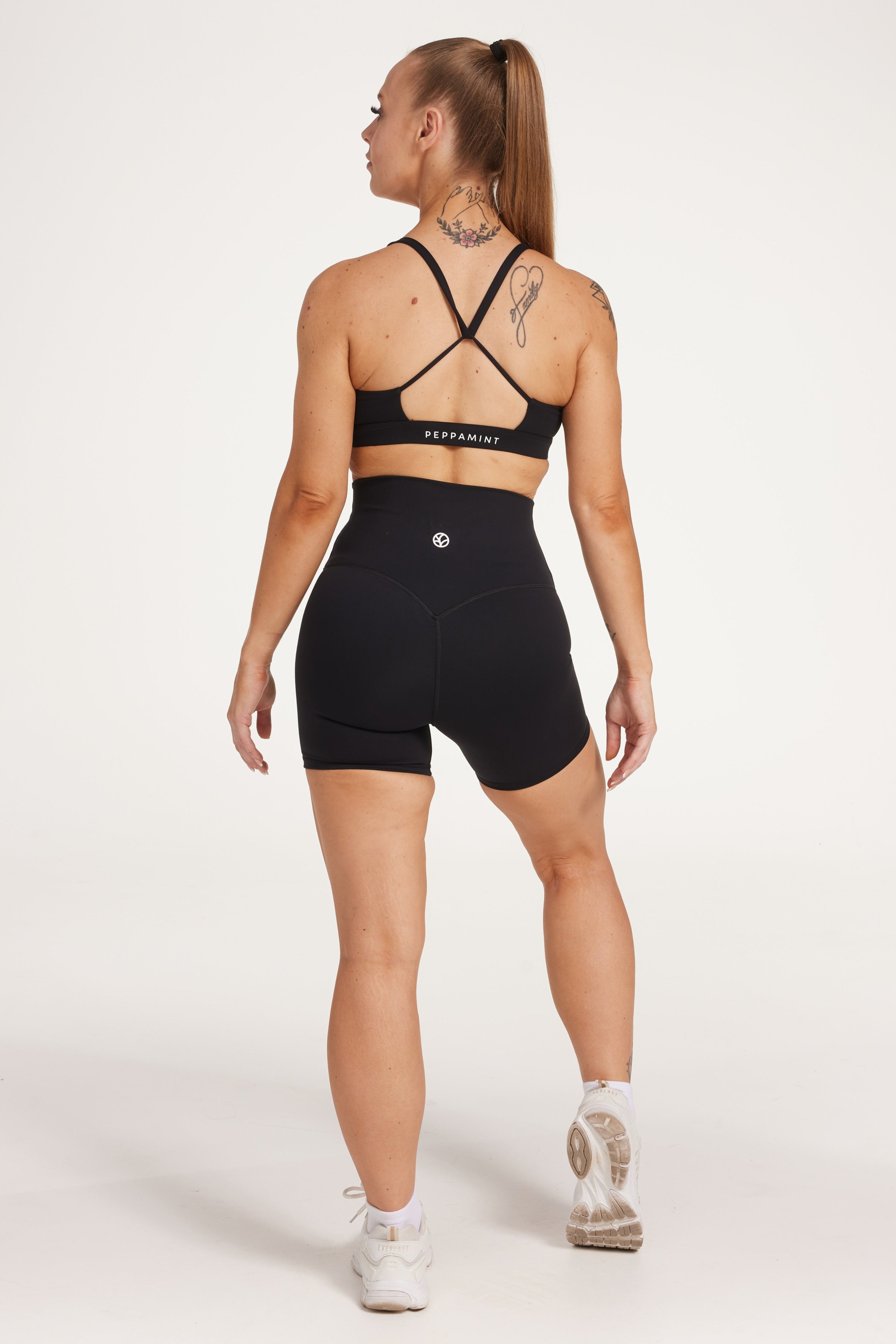 high waisted gym shorts, in buttery soft, supportive fabric with 6 inch inseam and no front rise seam, in black