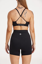 Load image into Gallery viewer, medium support buttery soft sports bra with cross over back straps and u neck front design in black
