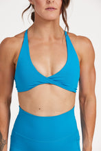 Load image into Gallery viewer, twist front bra with cross over back straps in a buttery soft blue coral fabric
