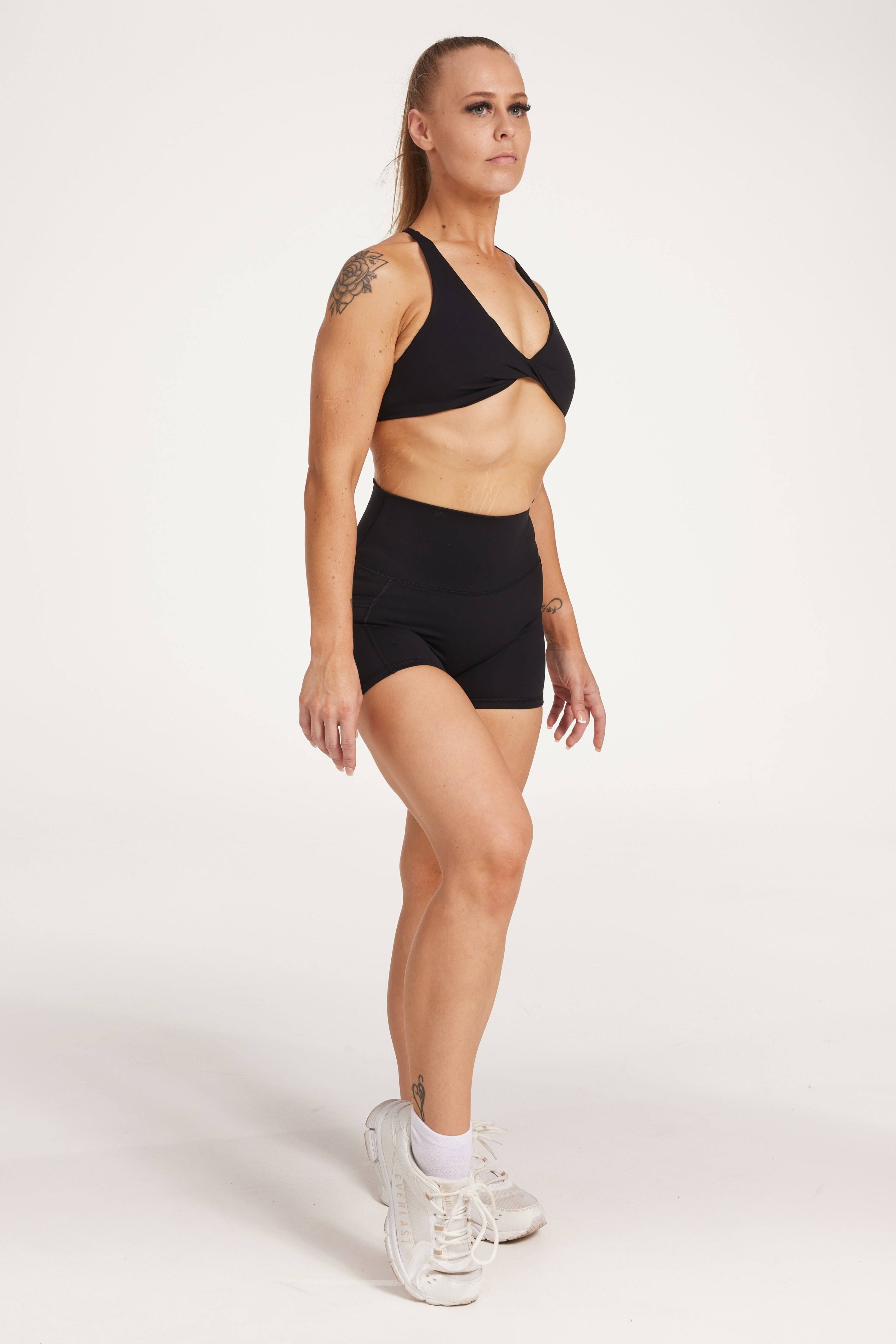 high waisted 4" inseam activewear shorts with no front rise seam, in a buttery soft, supportive fabric with twist front bra and cross over back straps