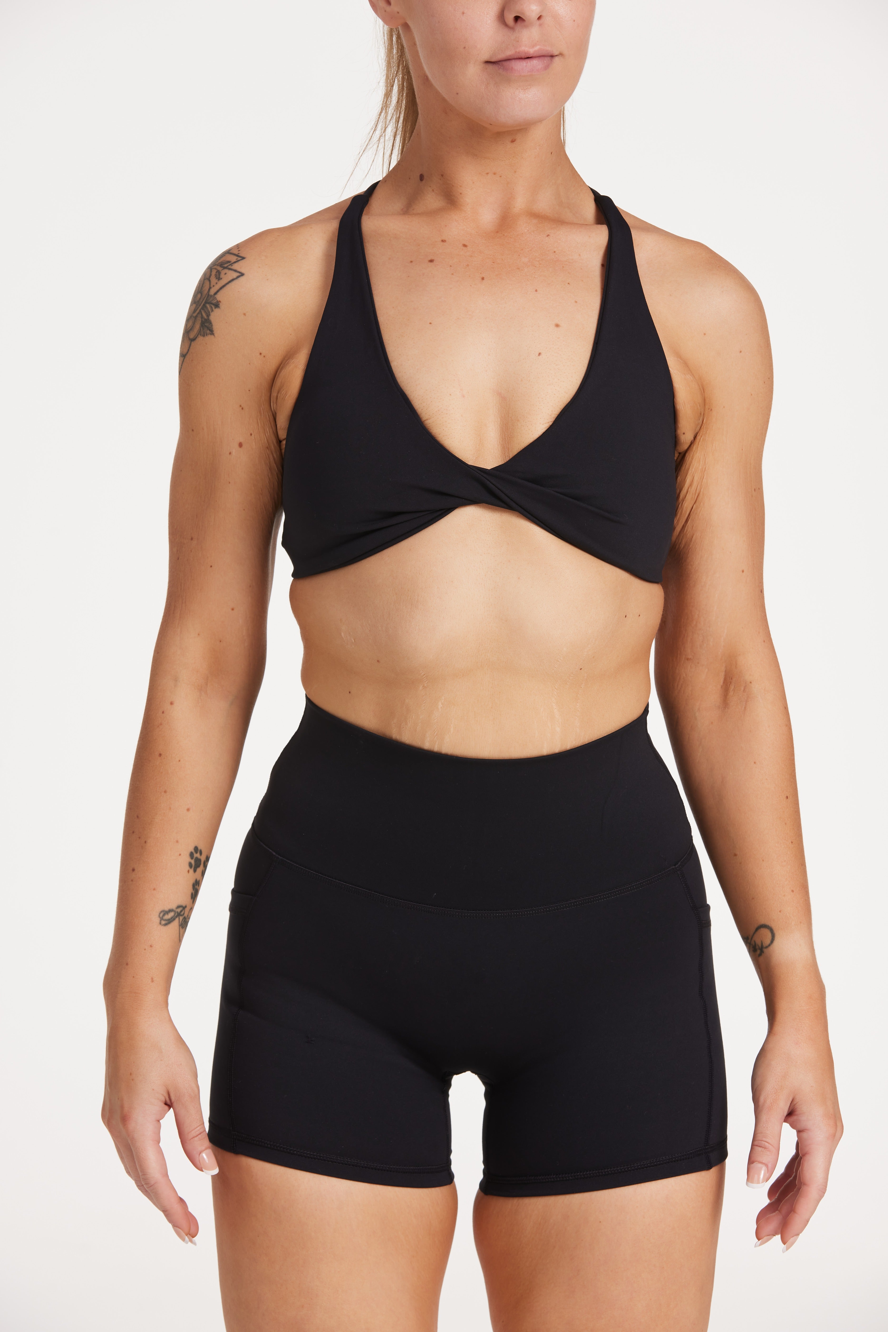 high waisted 4" inseam activewear shorts with no front rise seam, in a buttery soft, supportive fabric with twist front bra and cross over back straps