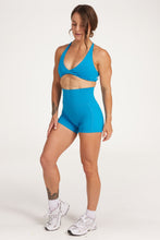 Load image into Gallery viewer, twist front bra with cross over back straps in a buttery soft blue coral fabric
