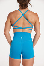 Load image into Gallery viewer, twist front bra with cross over back straps in a buttery soft blue coral fabric
