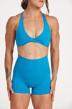 Load image into Gallery viewer, twist front bra with cross over back straps in a buttery soft blue coral fabric
