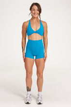 Load image into Gallery viewer, twist front bra with cross over back straps in a buttery soft blue coral fabric
