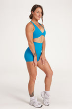 Load image into Gallery viewer, twist front bra with cross over back straps in a buttery soft blue coral fabric
