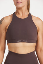 Load image into Gallery viewer, Buttery soft high neck women&#39;s sports bra with a supportive elasticated hem and triple layered fabric with removable pads for extra support and crossover back straps in Dark Chocolate.
