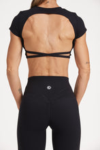 Load image into Gallery viewer, Buttery soft high waisted women&#39;s gym tights with curved hem stitched detailing for a butt shaping effect, and no front rise seam, paired with an open back women&#39;s crop t-shirt with a supportive elasticated hem and triple layered fabric with removable pads for extra support and aesthetic cross back straps in Black.
