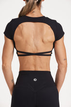 Load image into Gallery viewer, Buttery soft high waisted women&#39;s gym tights with curved hem stitched detailing for a butt shaping effect, and no front rise seam, paired with an open back women&#39;s crop t-shirt with a supportive elasticated hem and triple layered fabric with removable pads for extra support and aesthetic cross back straps in Black.
